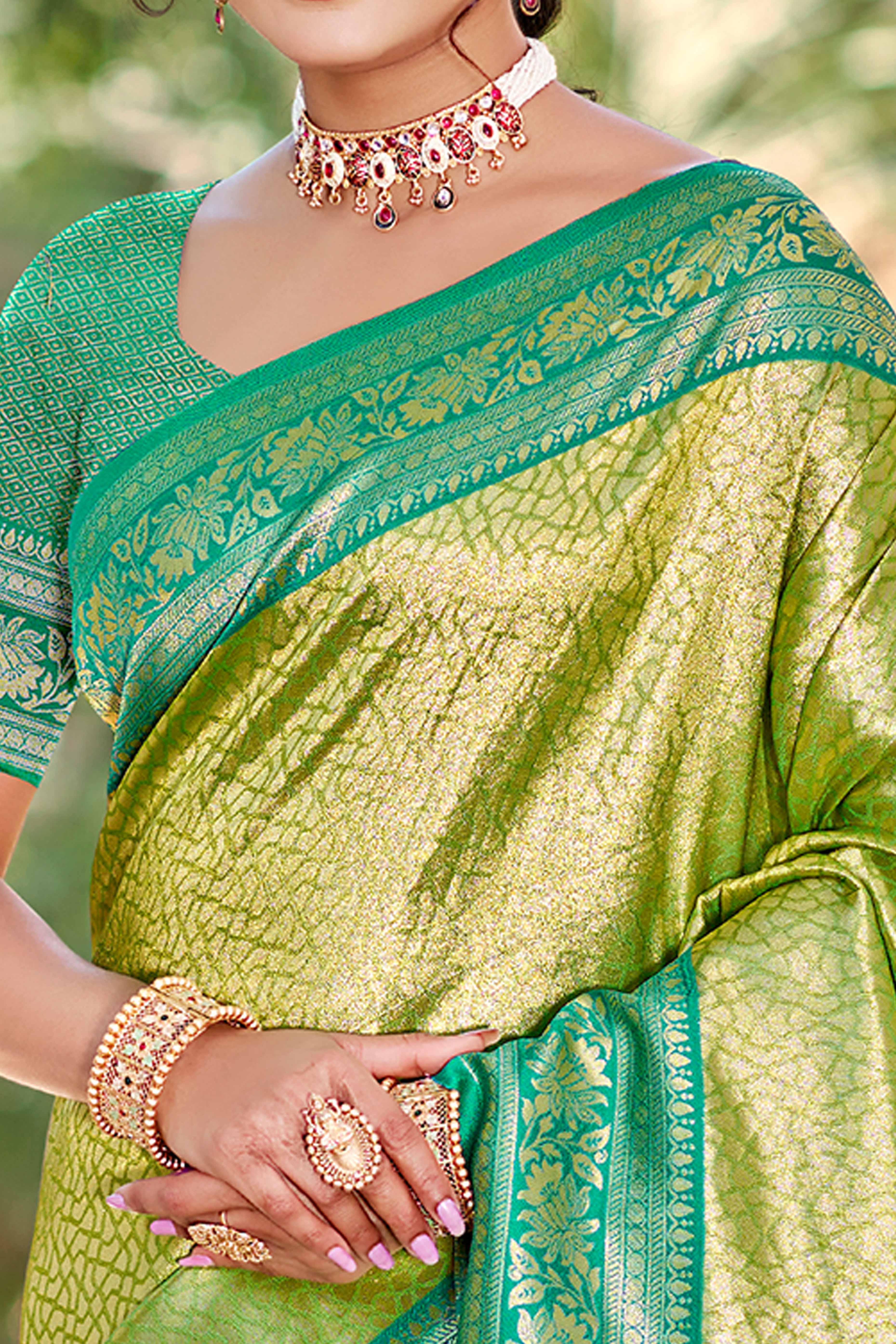Green Kanjivaram Silk Paithani Saree With Elegant Floral Weaving & Tassel Pallu