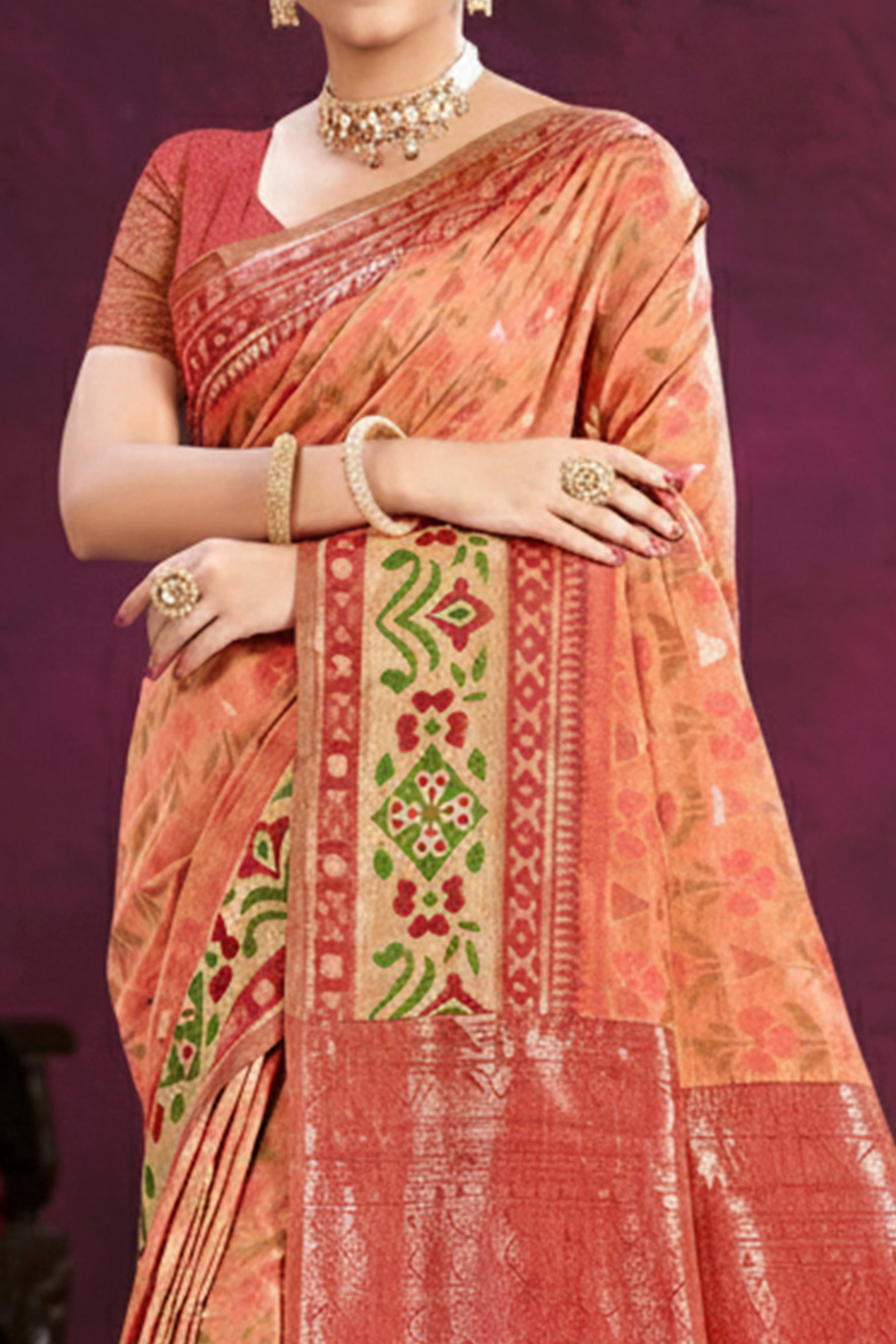 Designer Light Orange Cotton Silk Saree Showcasing Delicate Floral Weaving & Tassel Pallu