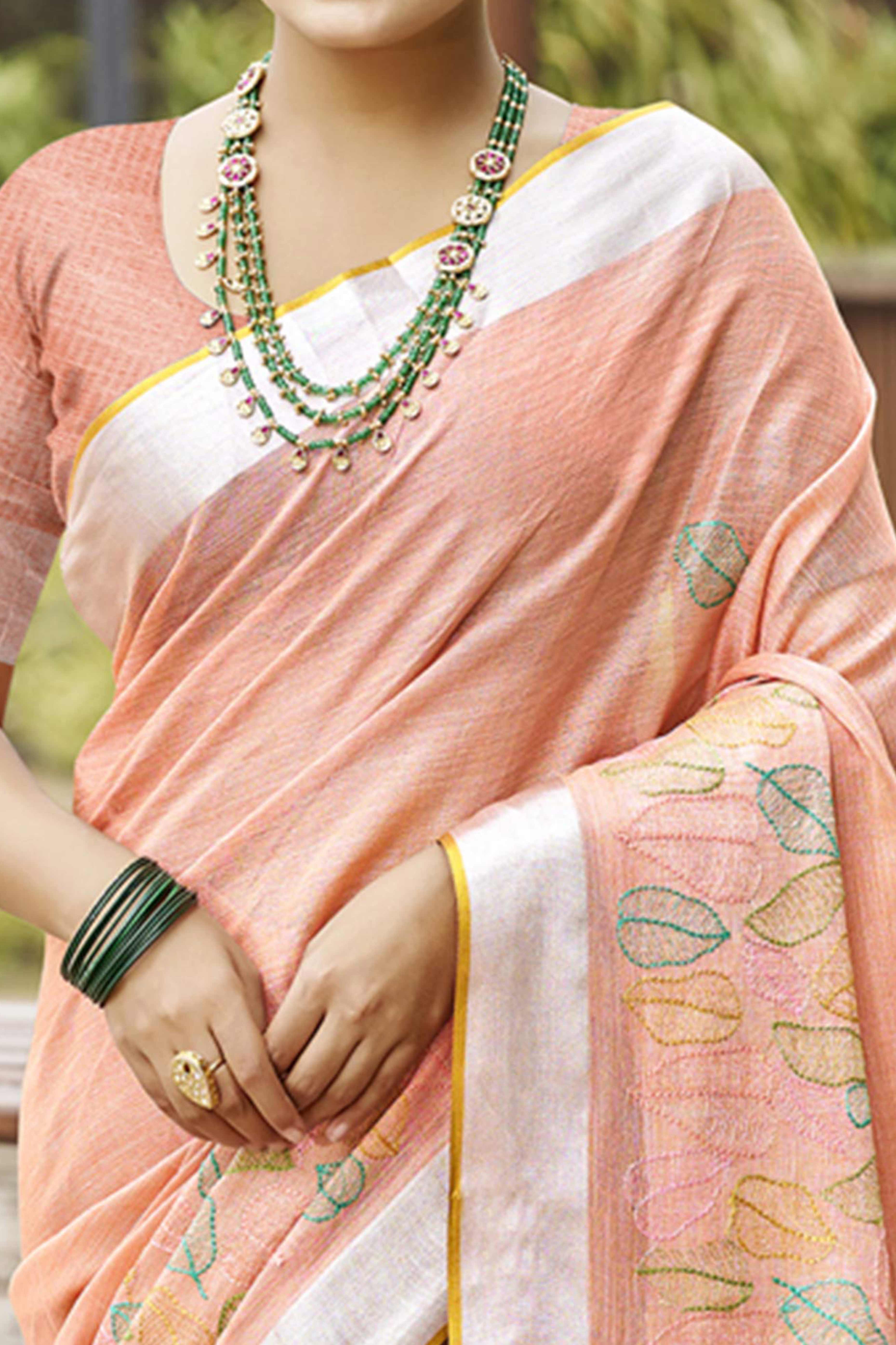 Classic Peach Leaf Pattern Thread Embroidery Work Linen Saree With Tassel Pallu