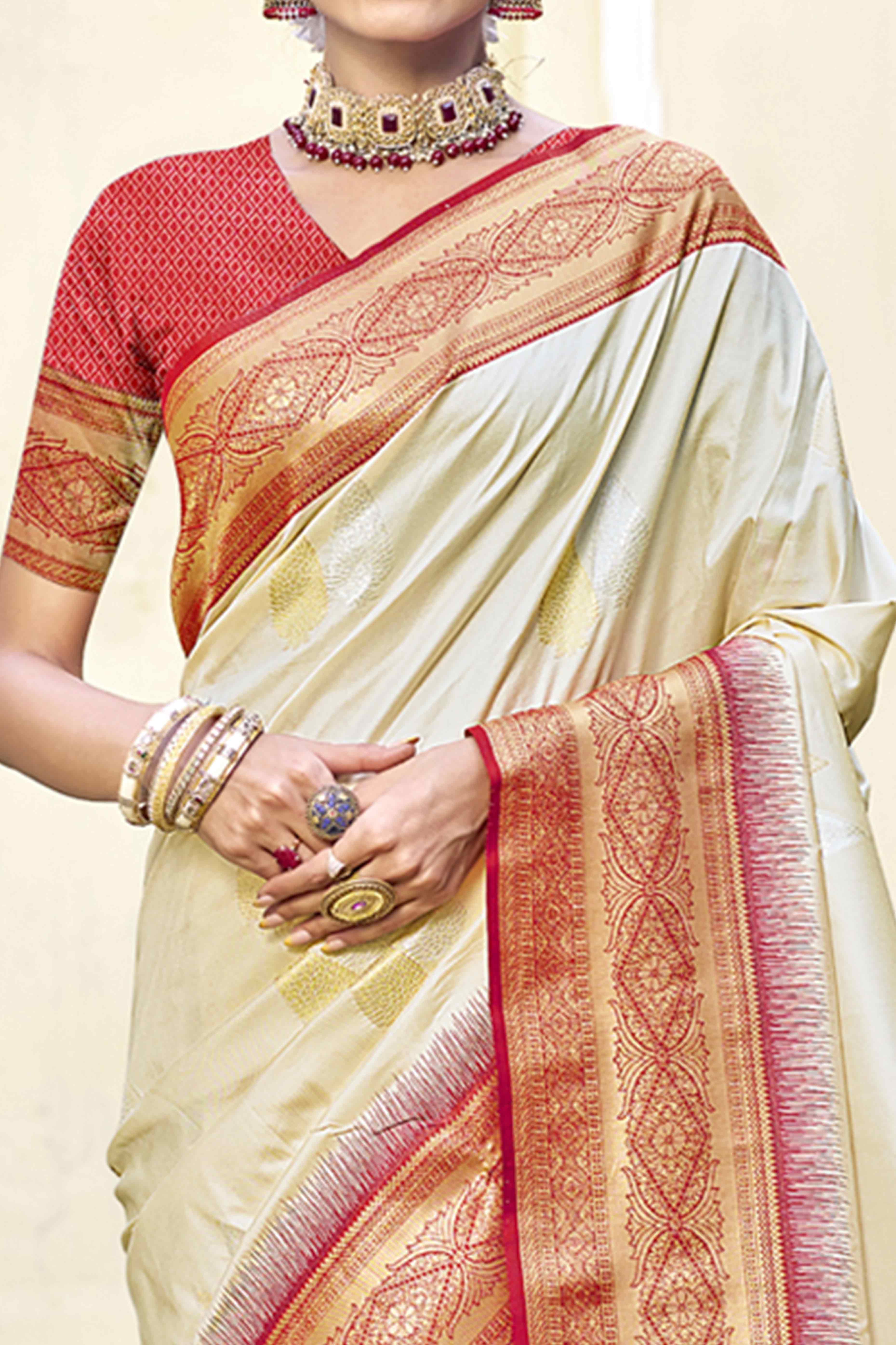 Cream Woven Banarasi Silk Saree With Tassels
