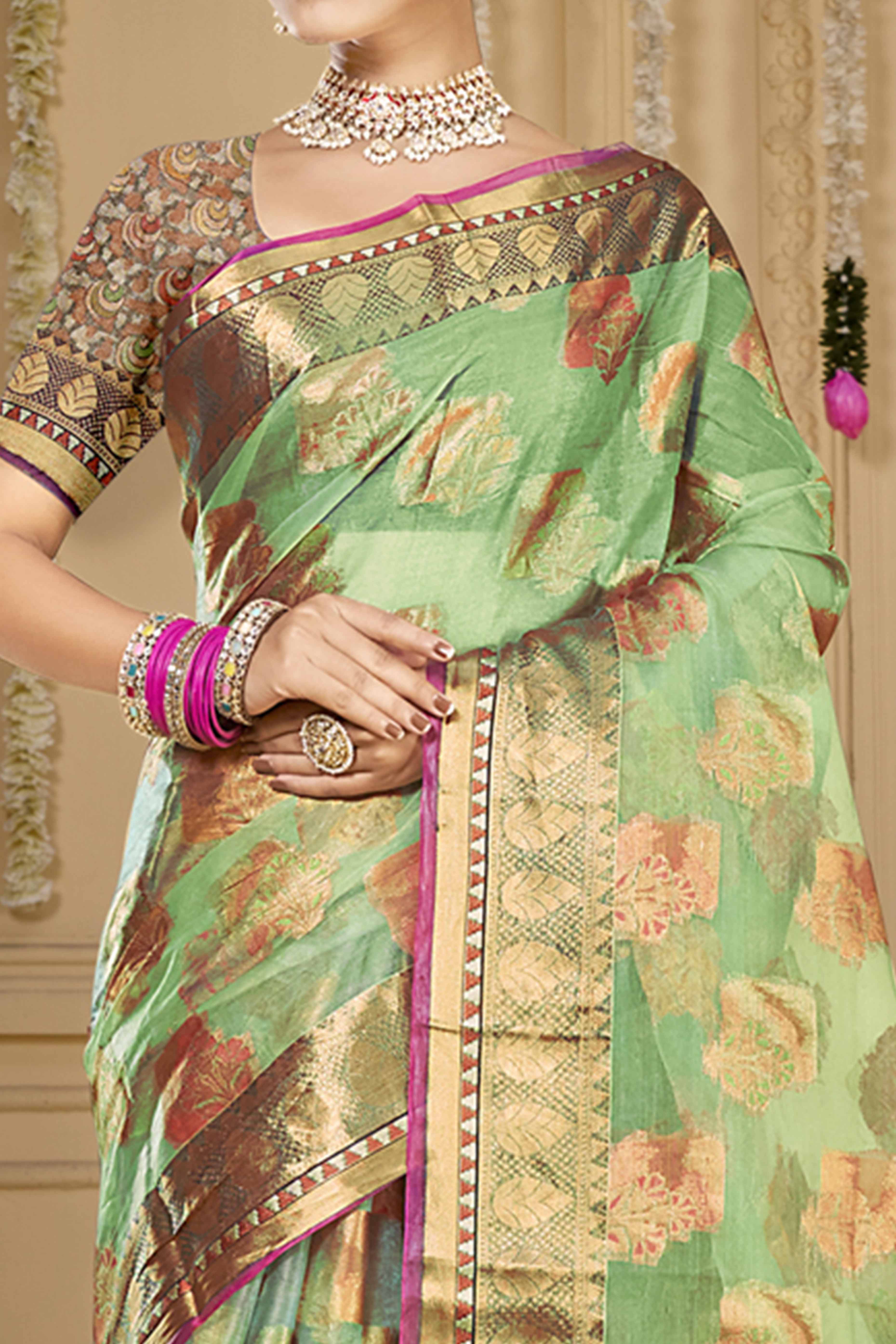 Pista Green Floral Woven Organza Saree With Tassels