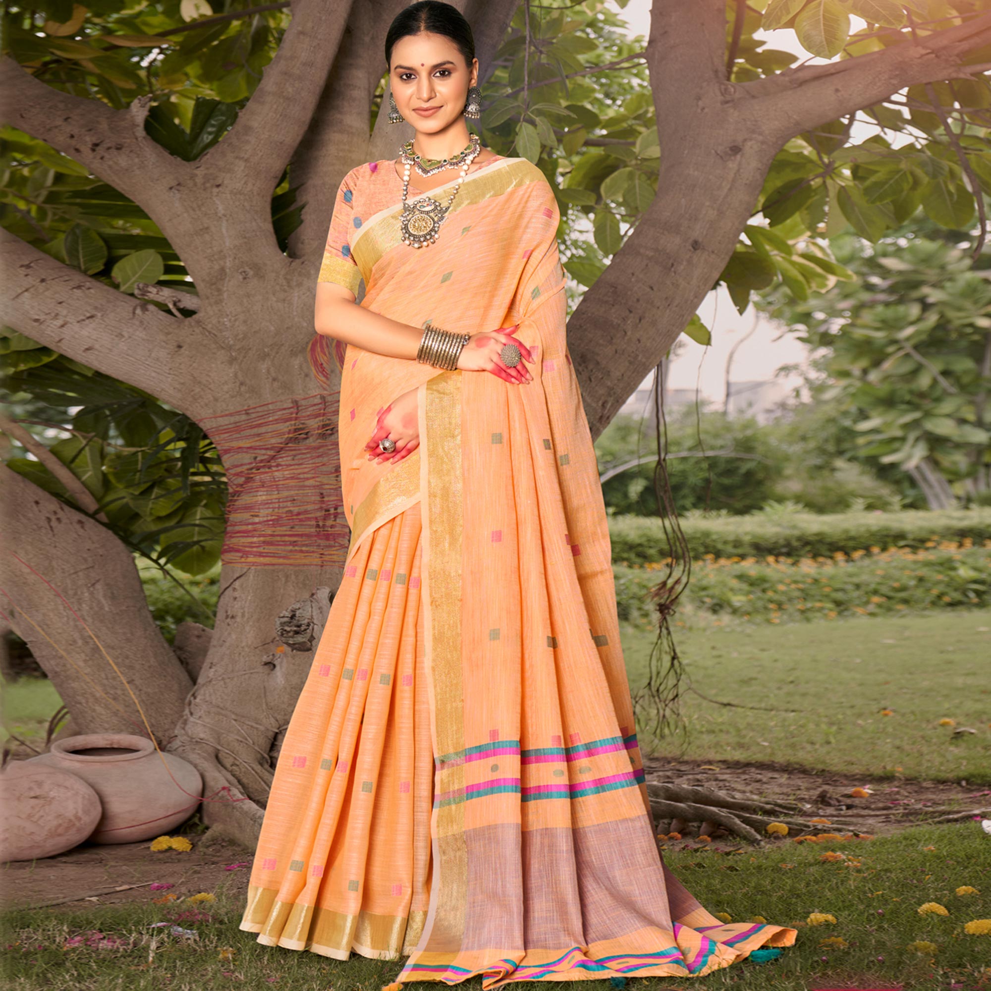 Orange Woven Cotton Blend Saree With Tassels