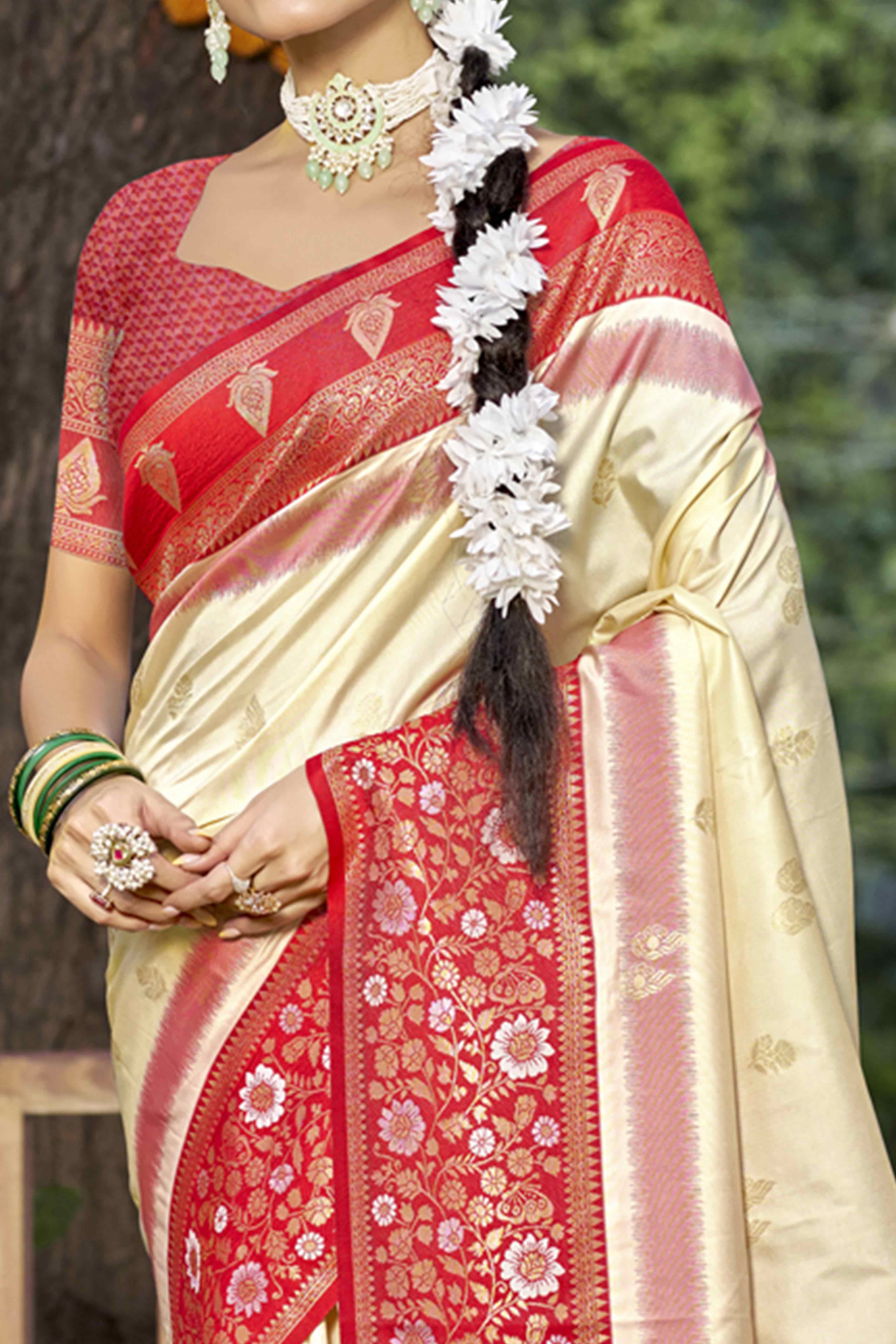 Cream Floral Woven Banarasi Silk Saree With Tassels