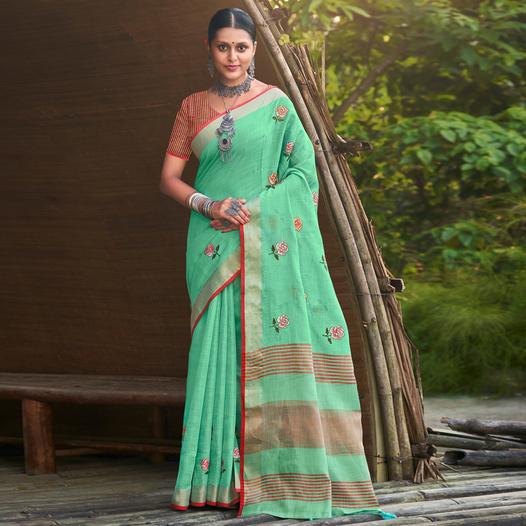 Sea Green Floral Embroidered Linen Saree With Tassels