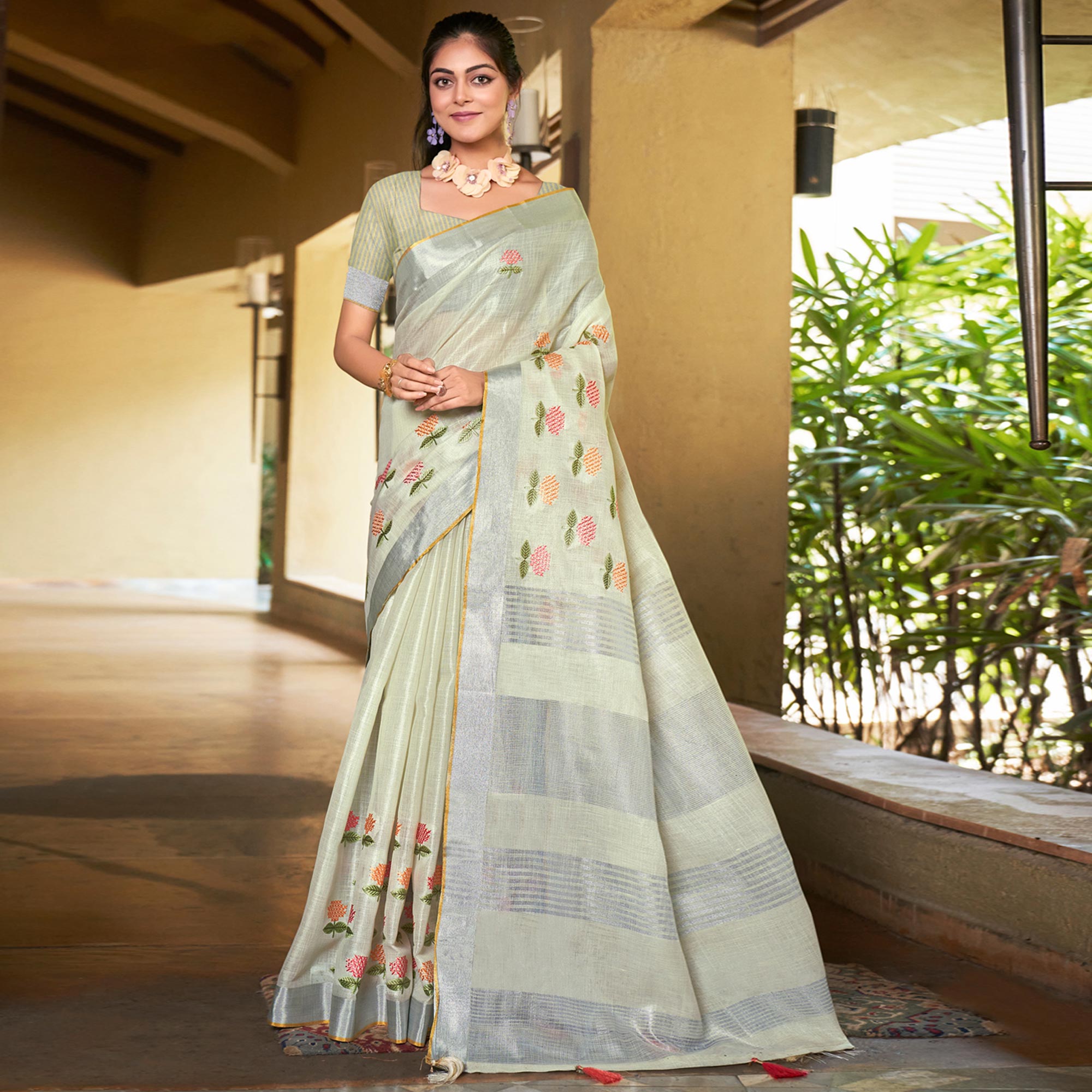 Pale Yellow Floral Embroidered Linen Saree With Tassels