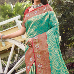 Turquoise Woven Banarasi Silk Saree With Tassels
