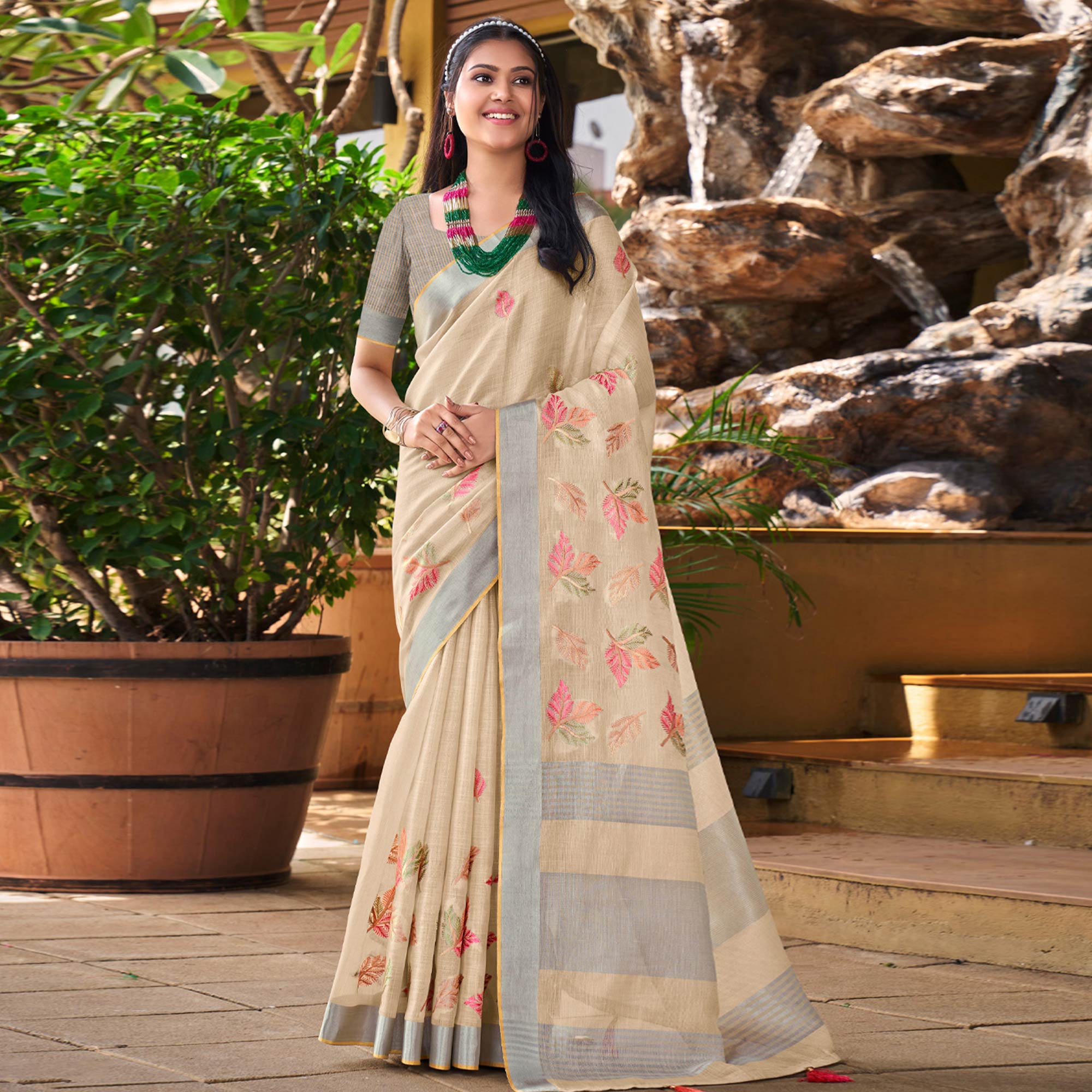 Beige Floral Embroidered Linen Saree With Tassels