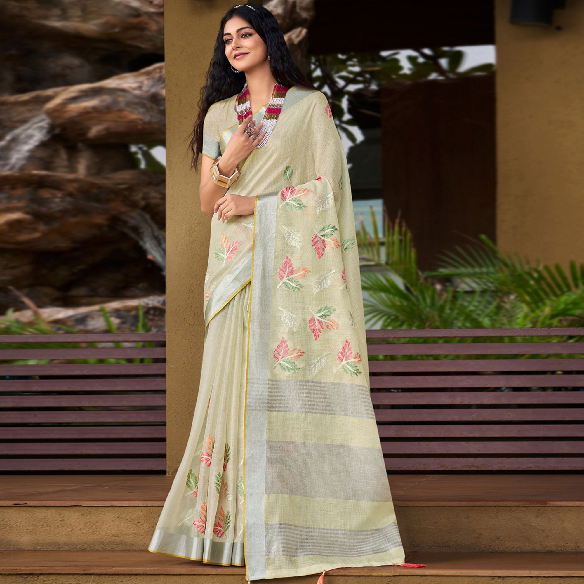 Pale Yellow Floral Embroidered Linen Saree With Tassels
