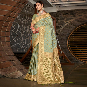 Light Green Woven Satin Silk Saree With Tassels