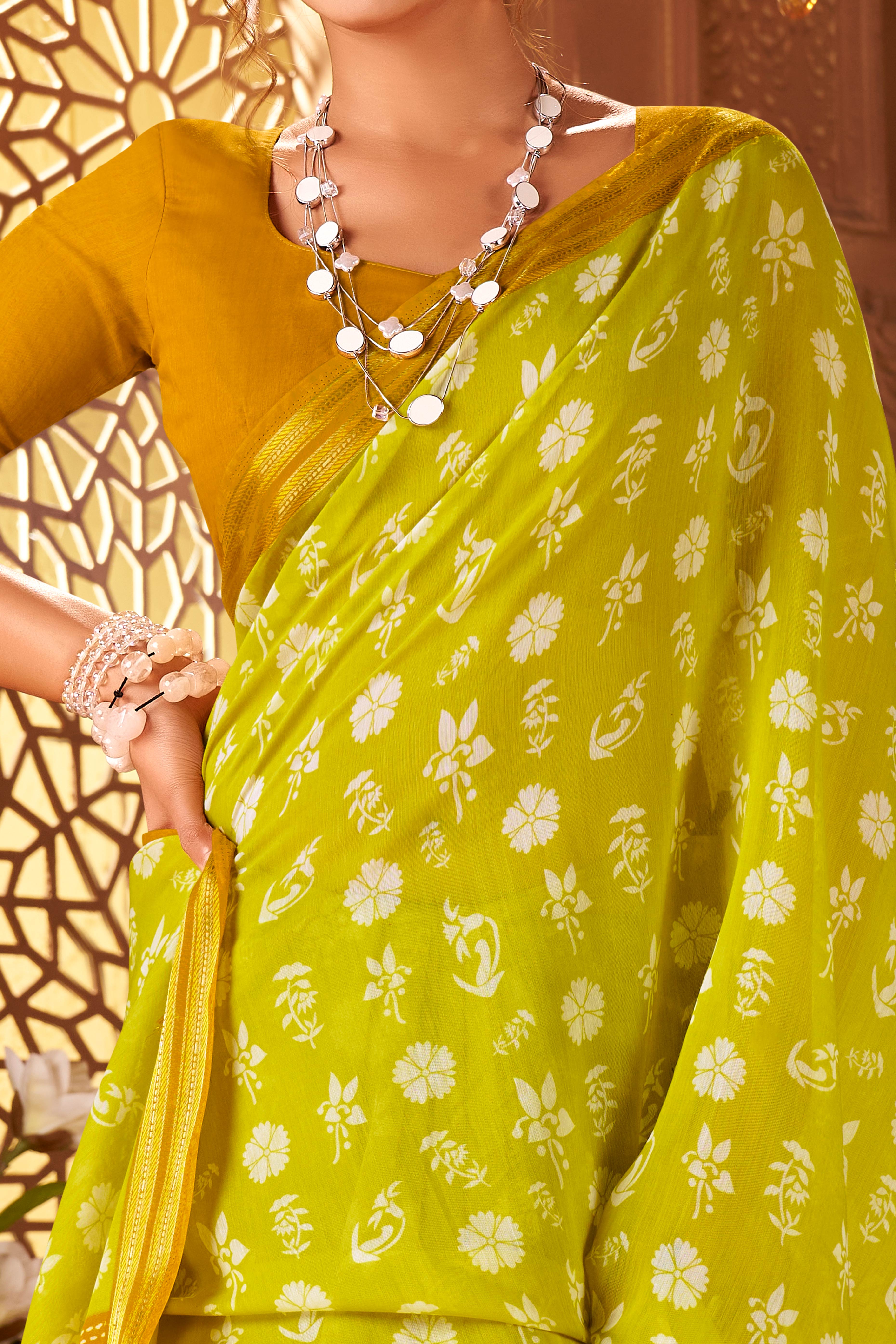 Sophisticated Lemon Green Mulmul Cotton Saree Featuring Delicate Floral Prints & Weaving Border