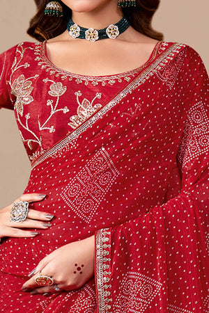 Red Bandhani Printed Georgette Saree Enhanced With Sequins & Cording Embroidered Lace Border