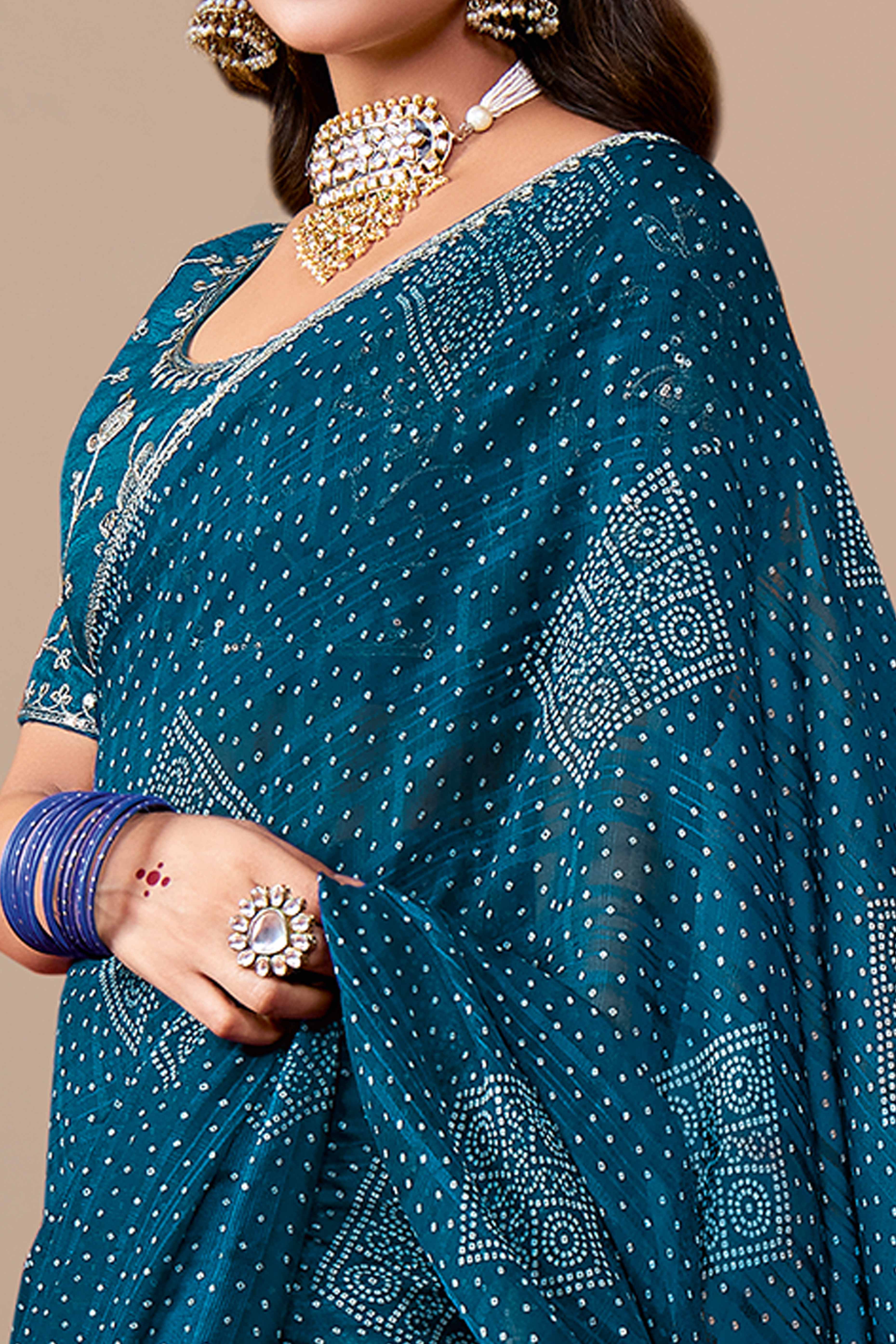Teal Blue Bandhani Printed Georgette Saree Enhanced With Sequins & Cording Embroidered Lace Border