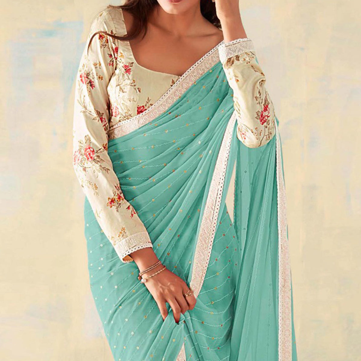 Aqua Blue Foil Printed Georgette Saree With Embroidered Border