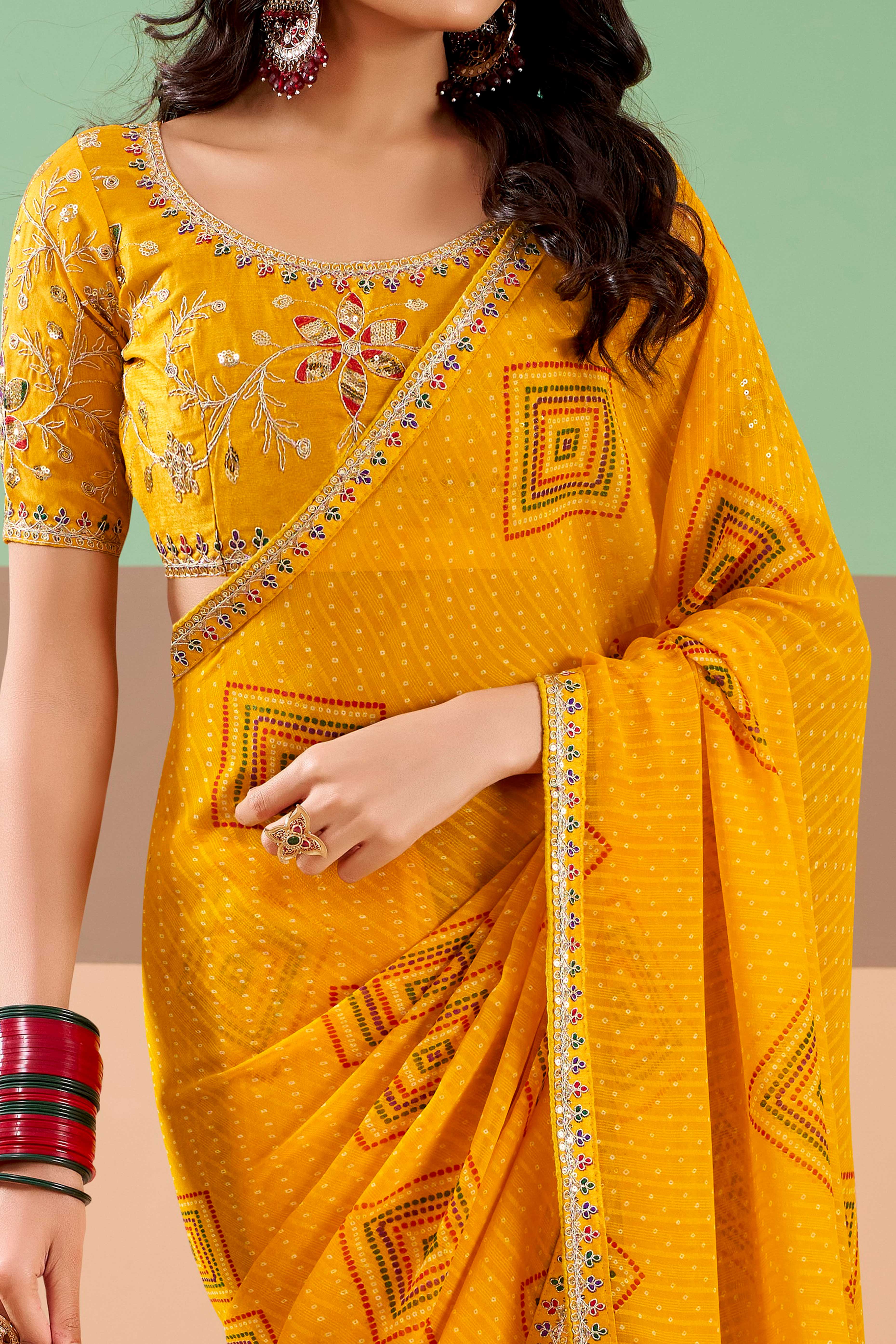 Charming Mustard Bandhani Printed Georgette Saree Adorned With Cording Embroidered Border