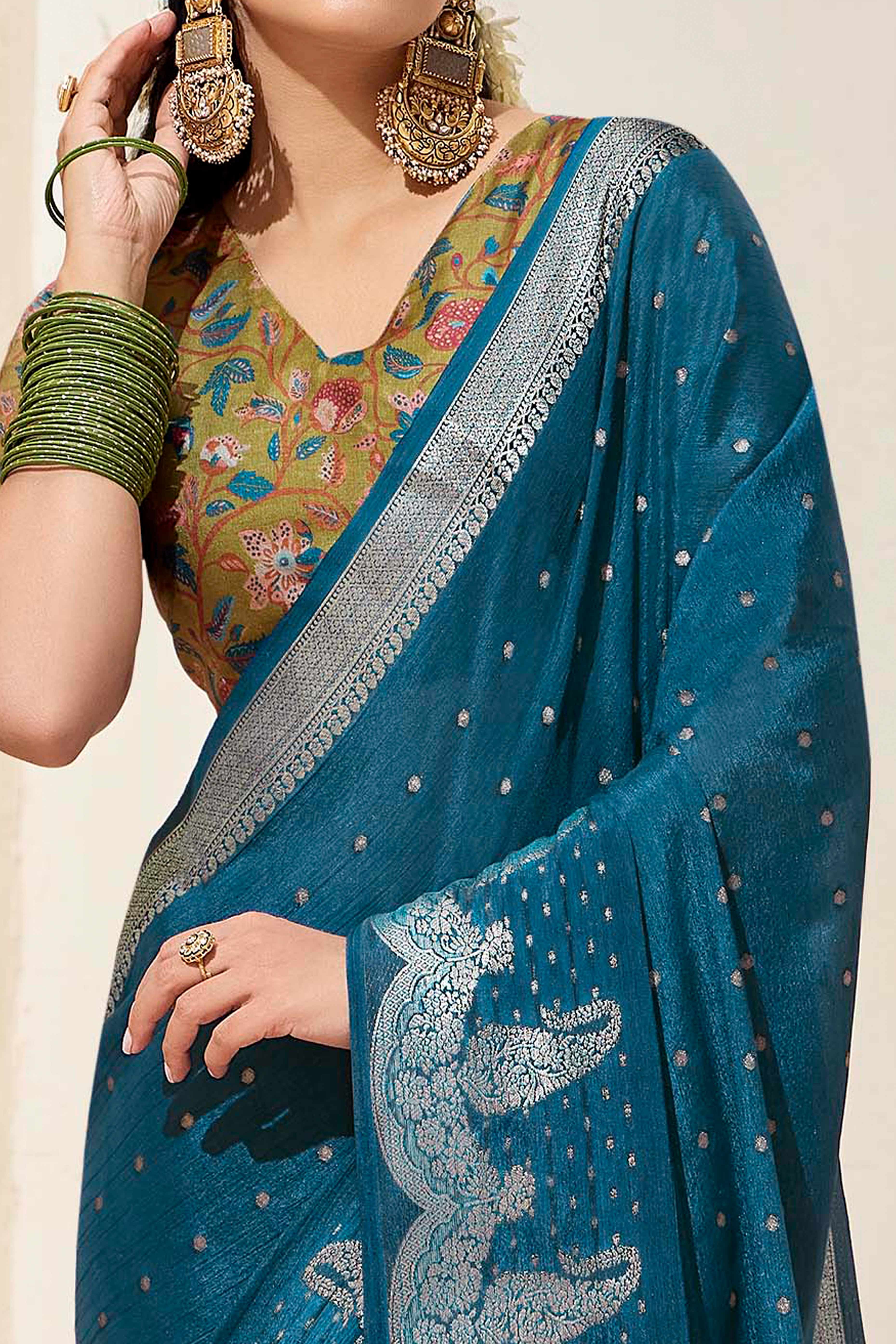 Teal Chinon Saree with Jacquard Weaving and Delicate Tassel Accents