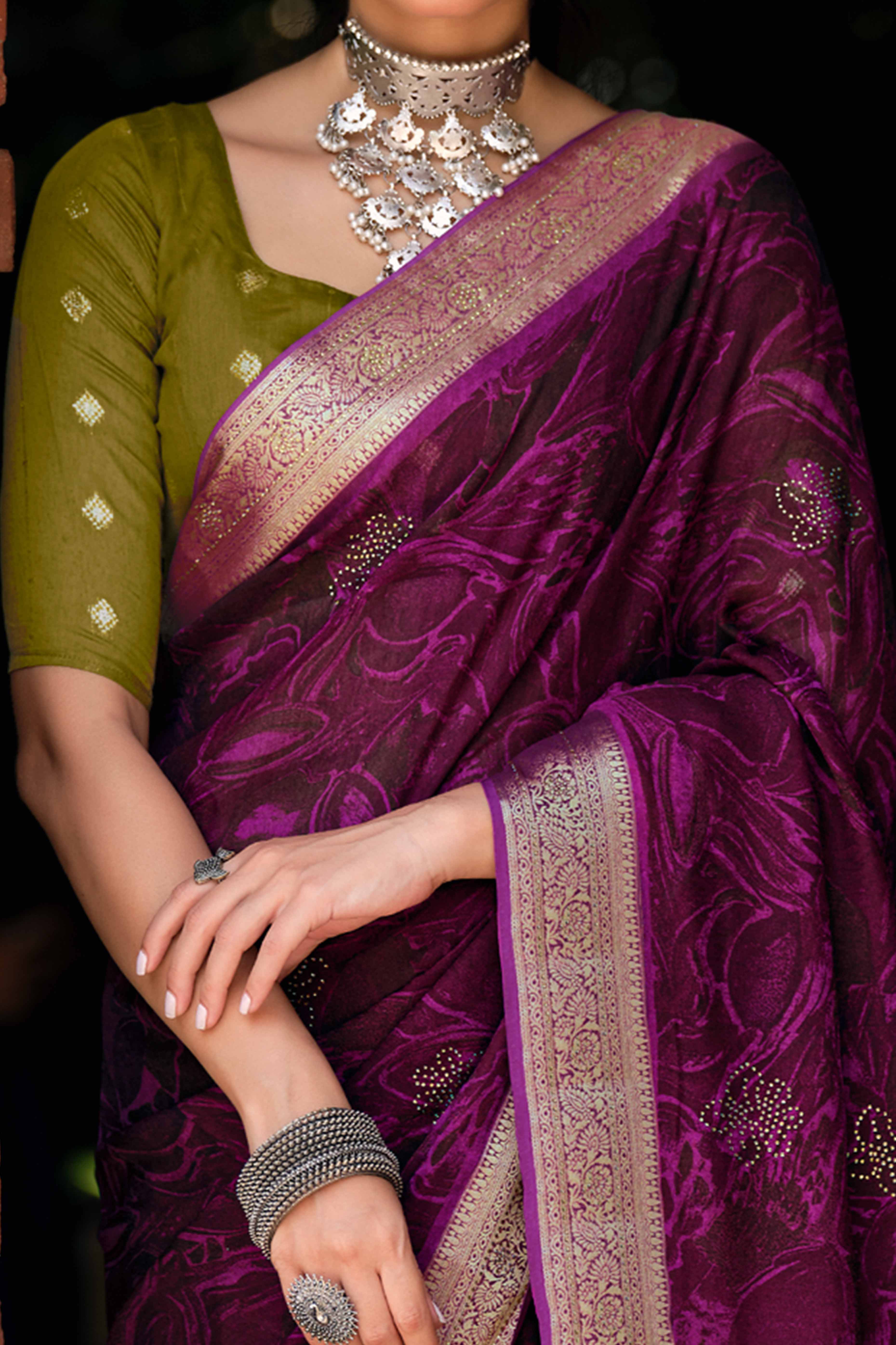 Magenta Abstract Printed Georgette Saree Enhanced with Subtle and Shiny Stone Work