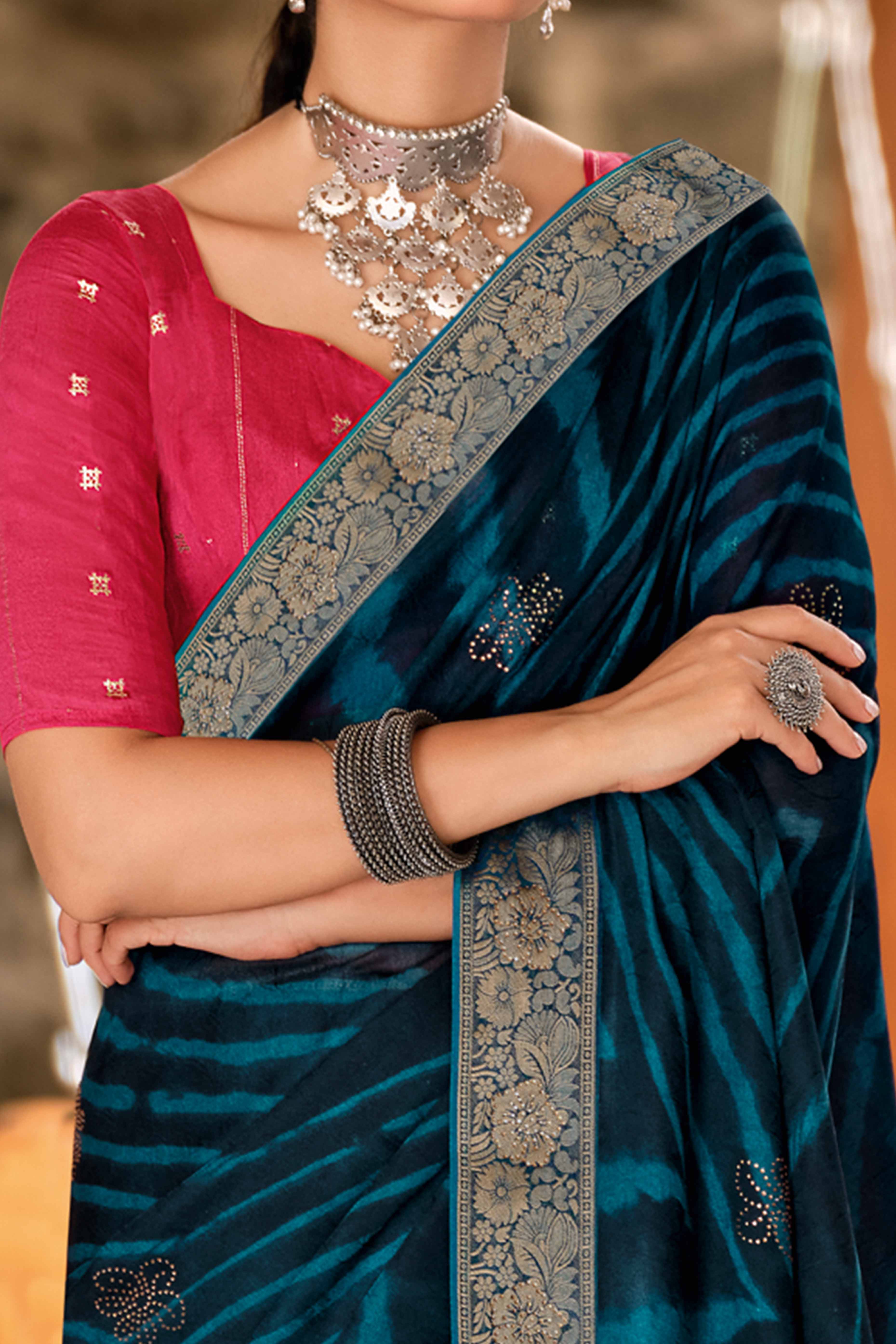 Morpich Blue Abstract Printed Georgette Saree Enhanced with Subtle and Shiny Stone Work
