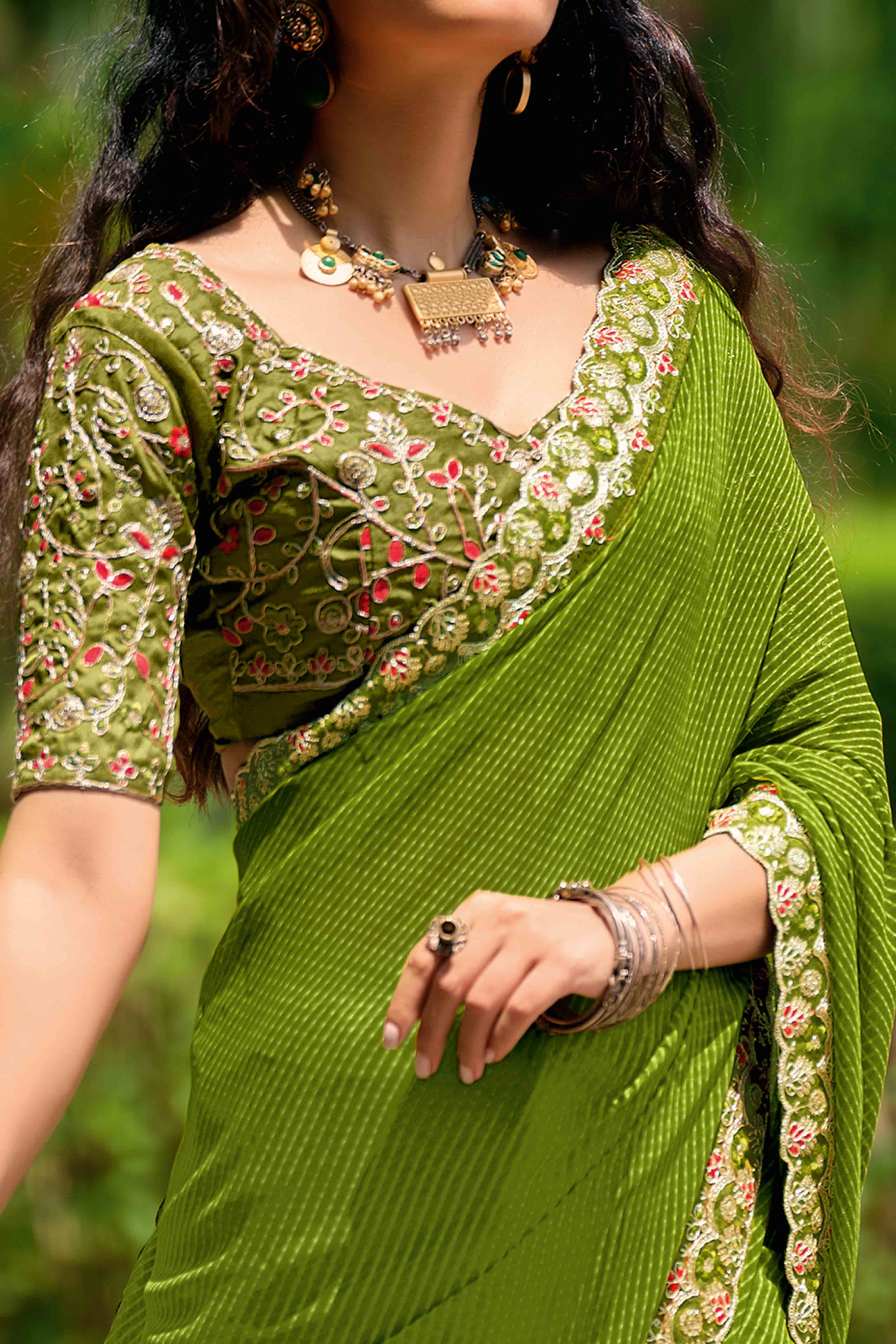 Green Striped Printed Georgette Saree With Shimmering Sequin Embroidered Border