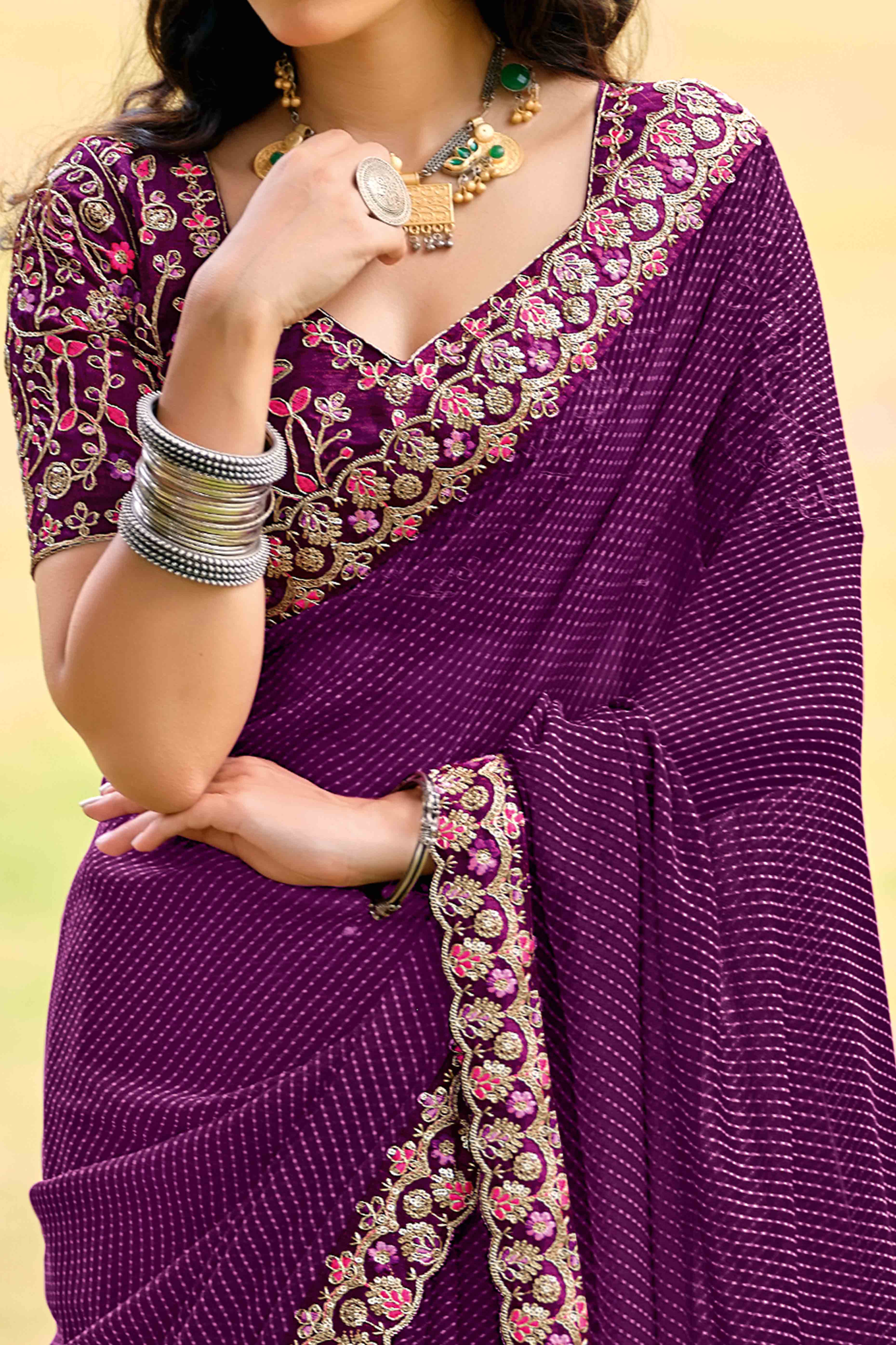 Purple Striped Printed Georgette Saree With Shimmering Sequin Embroidered Border