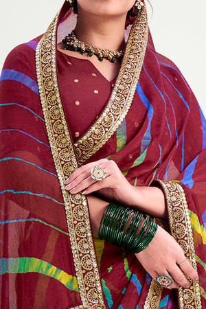 Maroon Striped Printed Chiffon Saree Enhanced With Sparkling Sequins Embroidered Border Work
