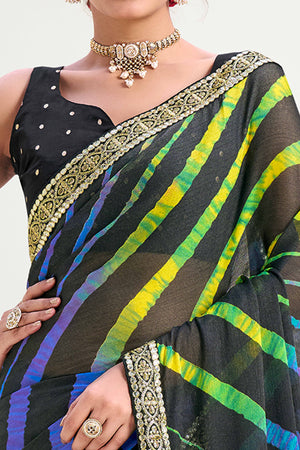 Black Striped Printed Chiffon Saree Enhanced With Sparkling Sequins Embroidered Border Work