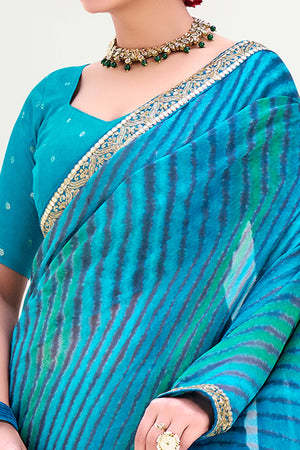 Blue Striped Printed Chiffon Saree Enhanced With Sparkling Sequins Embroidered Border Work