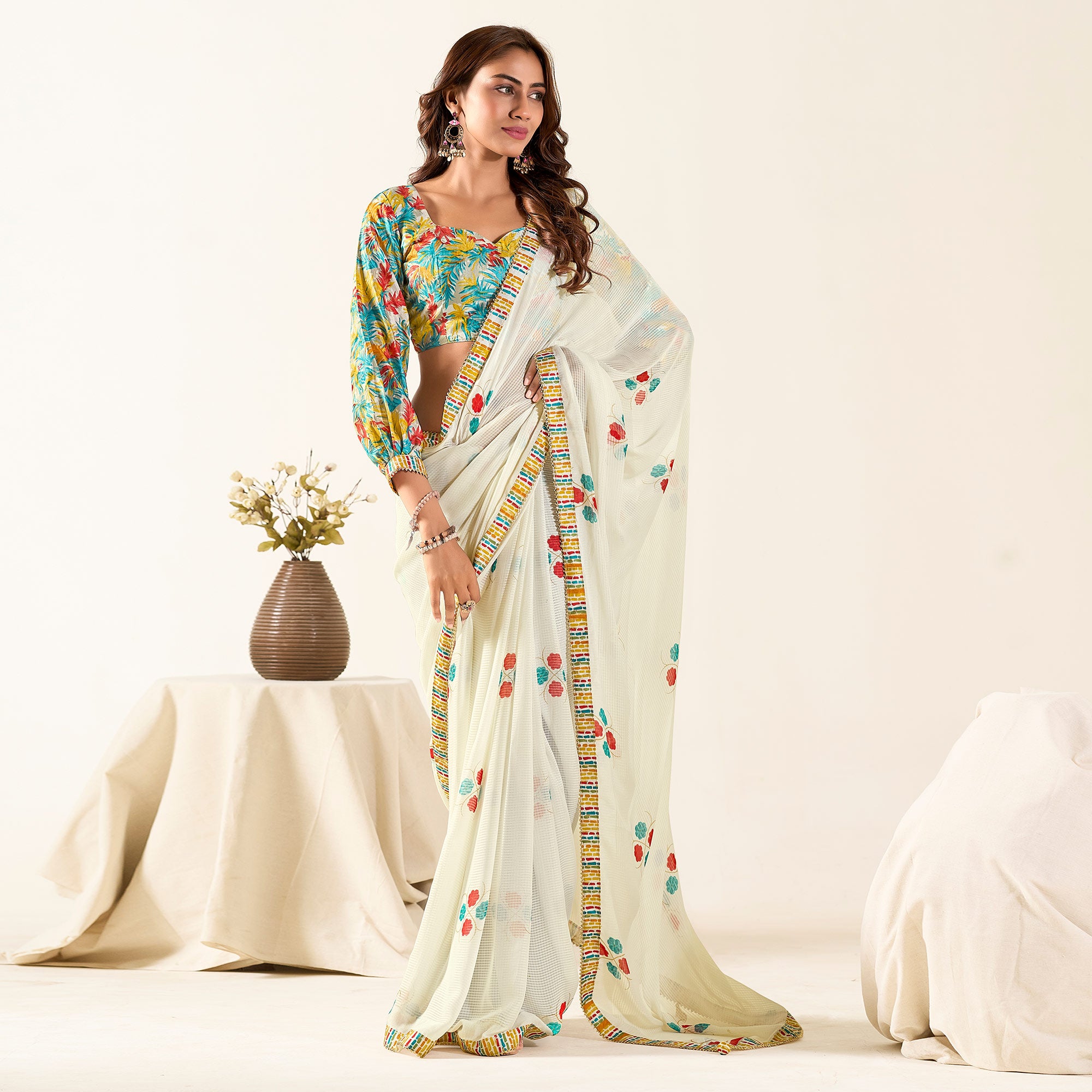 Off White Printed With Woven Georgette Saree With Tassels