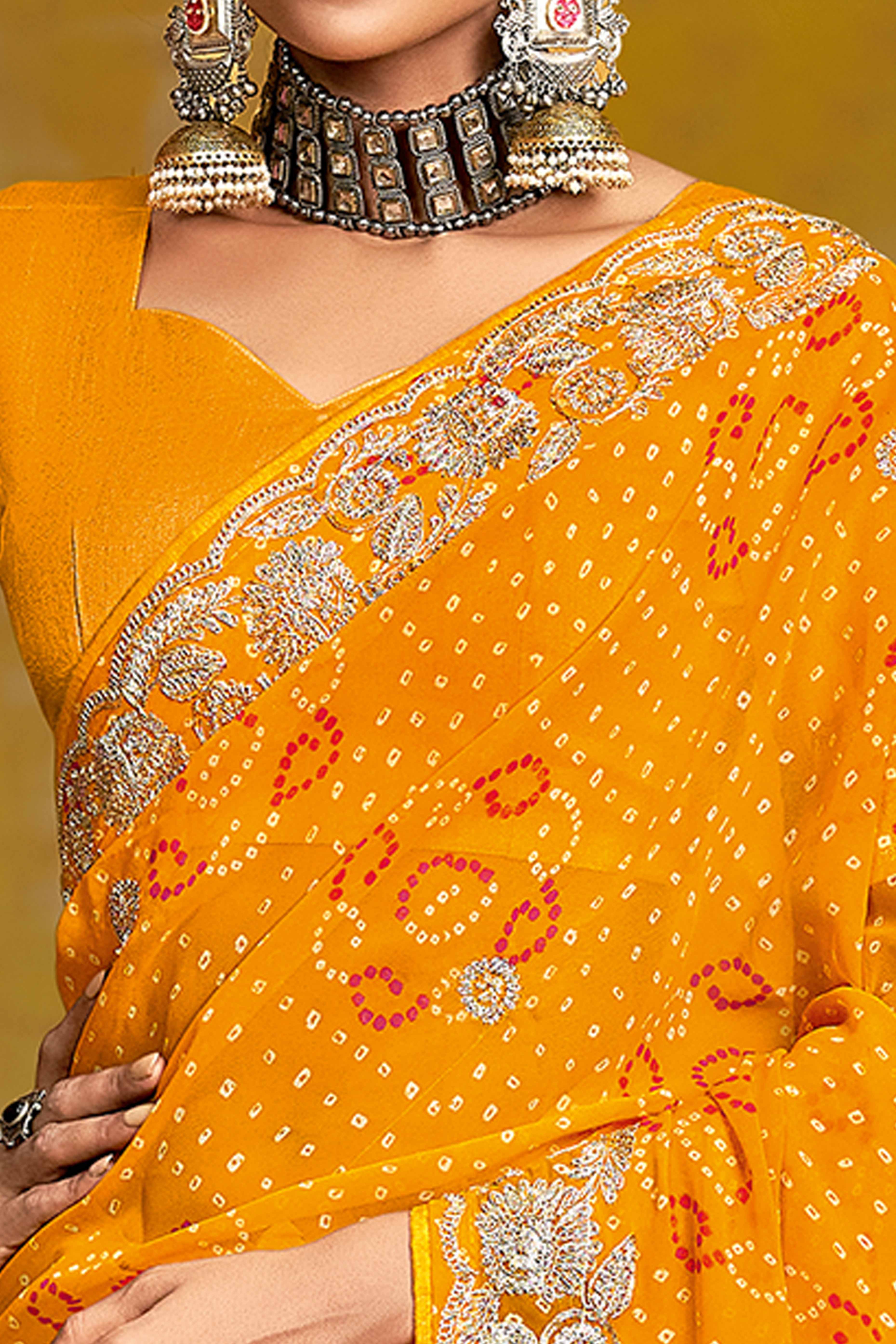 Mustard Georgette Saree Adorned With Traditional Bandhani Prints & Intricate Floral Embroidery