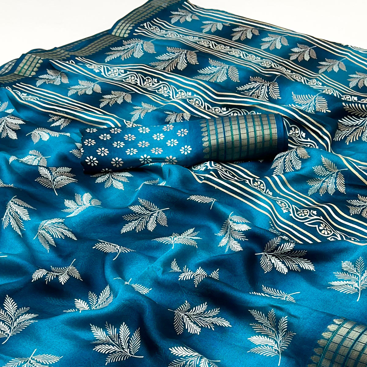 Teal Floral Printed Georgette Saree Featuring Weaving Border Design