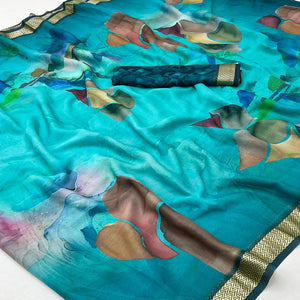 Graceful Turquoise Georgette Saree Accented With Digital Prints & Viscose Border Finish
