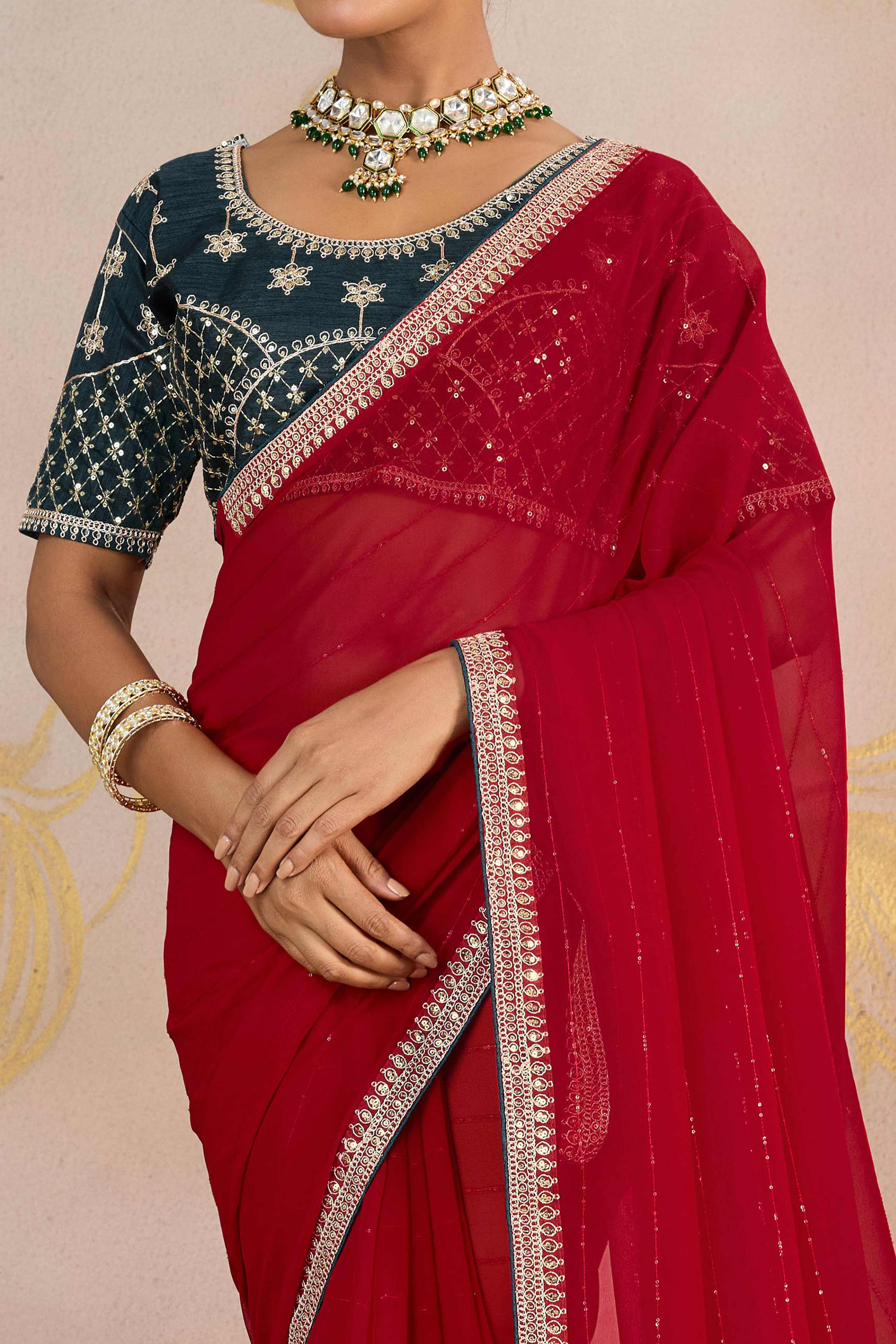 Red Zari Embroidered Georgette Saree Accented With Sequins