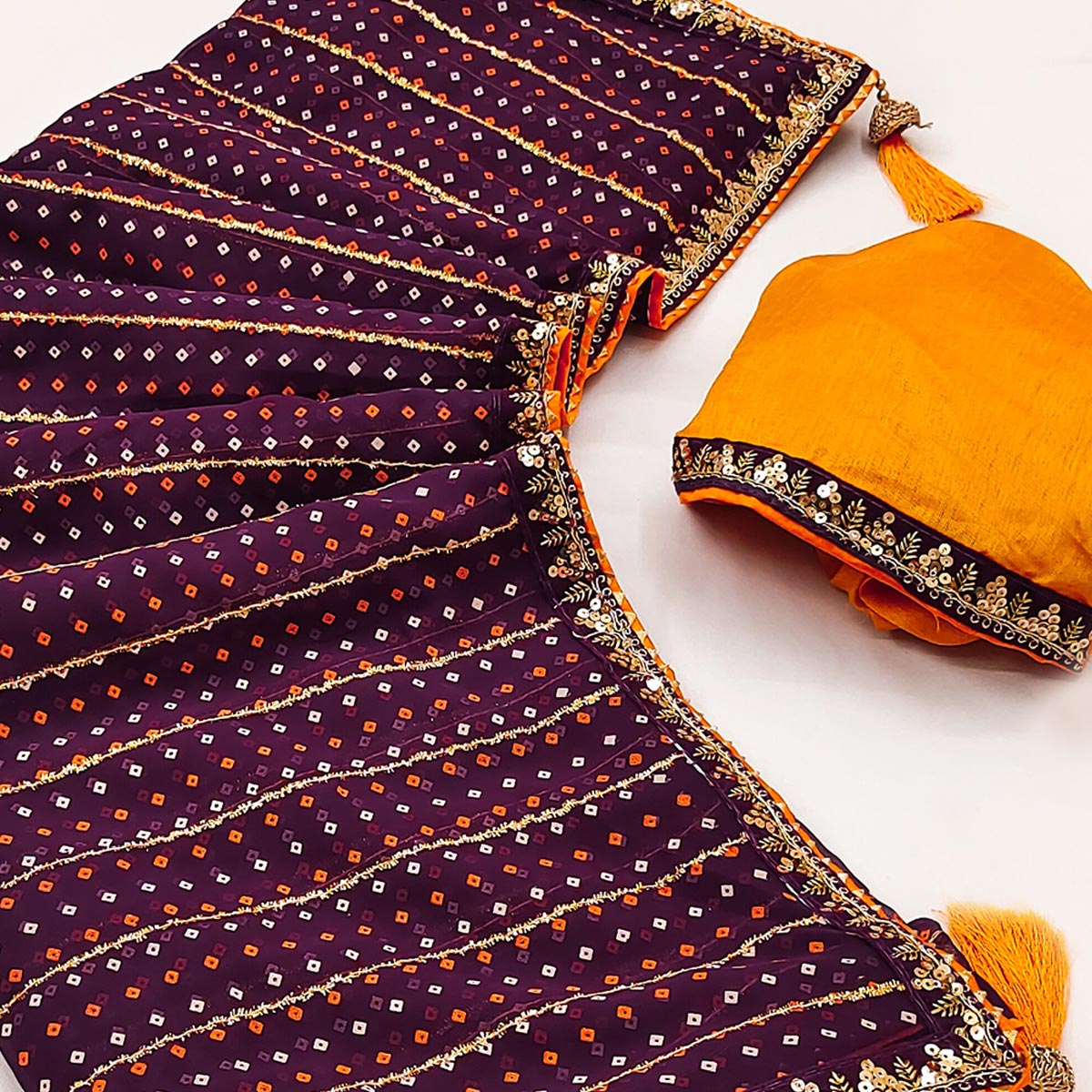 Charming Wine Bandhani Printed Georgette Saree With Glittering Sequins & Zari Border