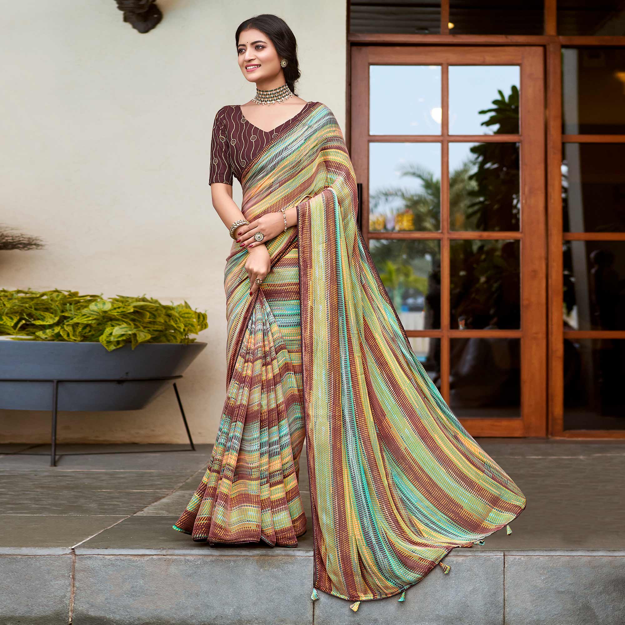 Brown Printed Chiffon Saree With Tassels