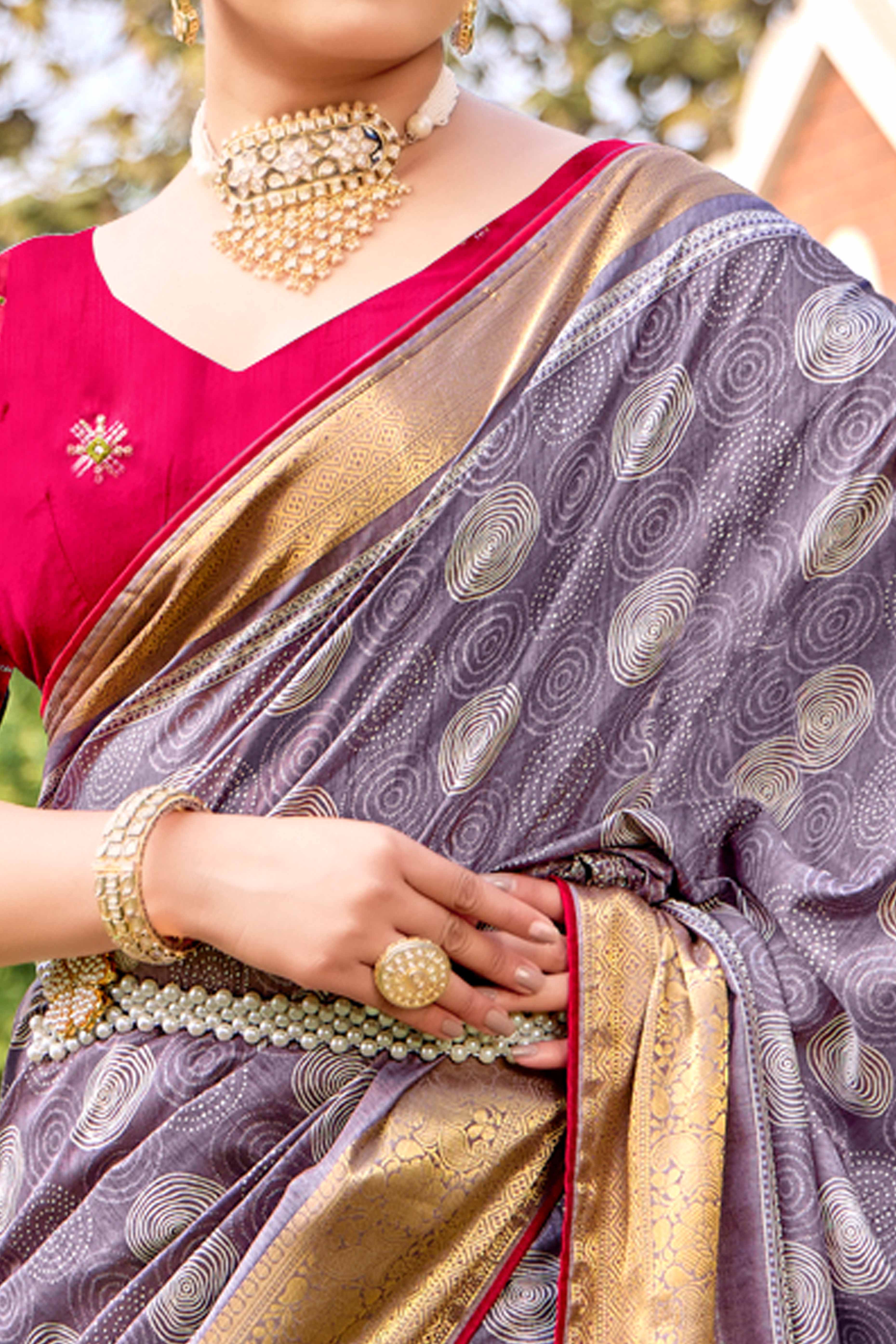 Lavender Printed Dola Silk Saree With Ornate Zari Border & Tassel Pallu