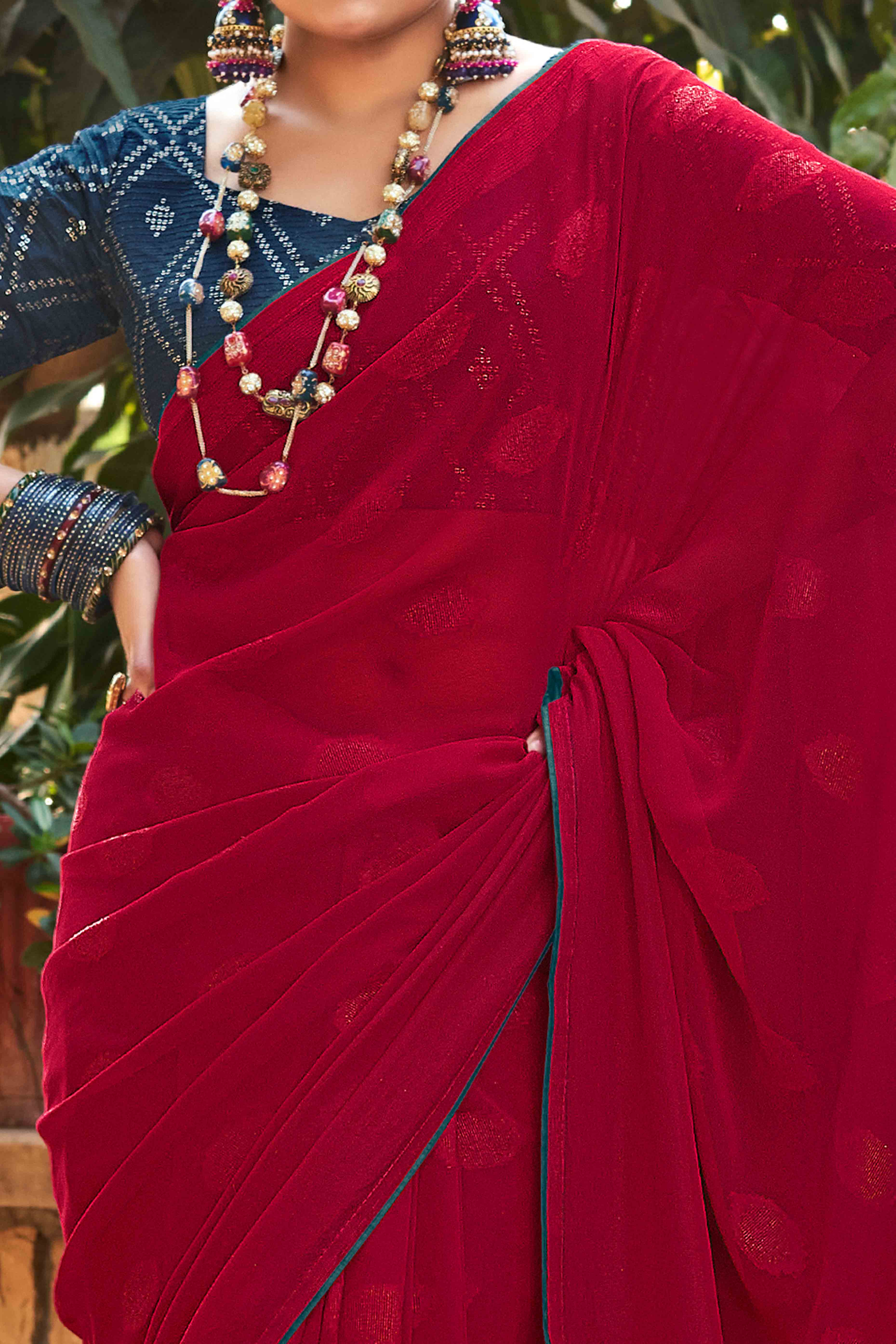 Cherry Red Woven Georgette Saree With Tassels