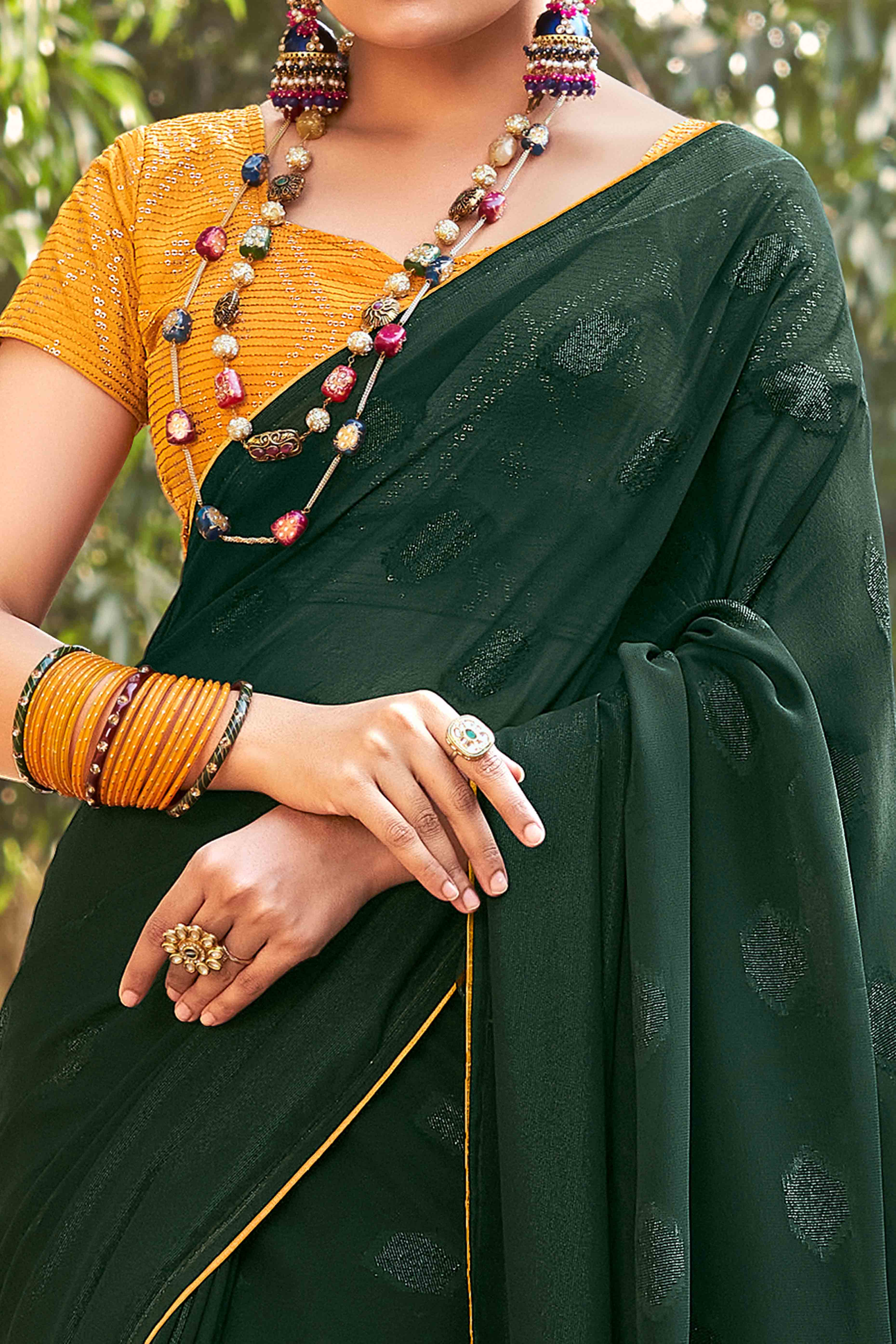 Green Woven Georgette Saree With Tassels