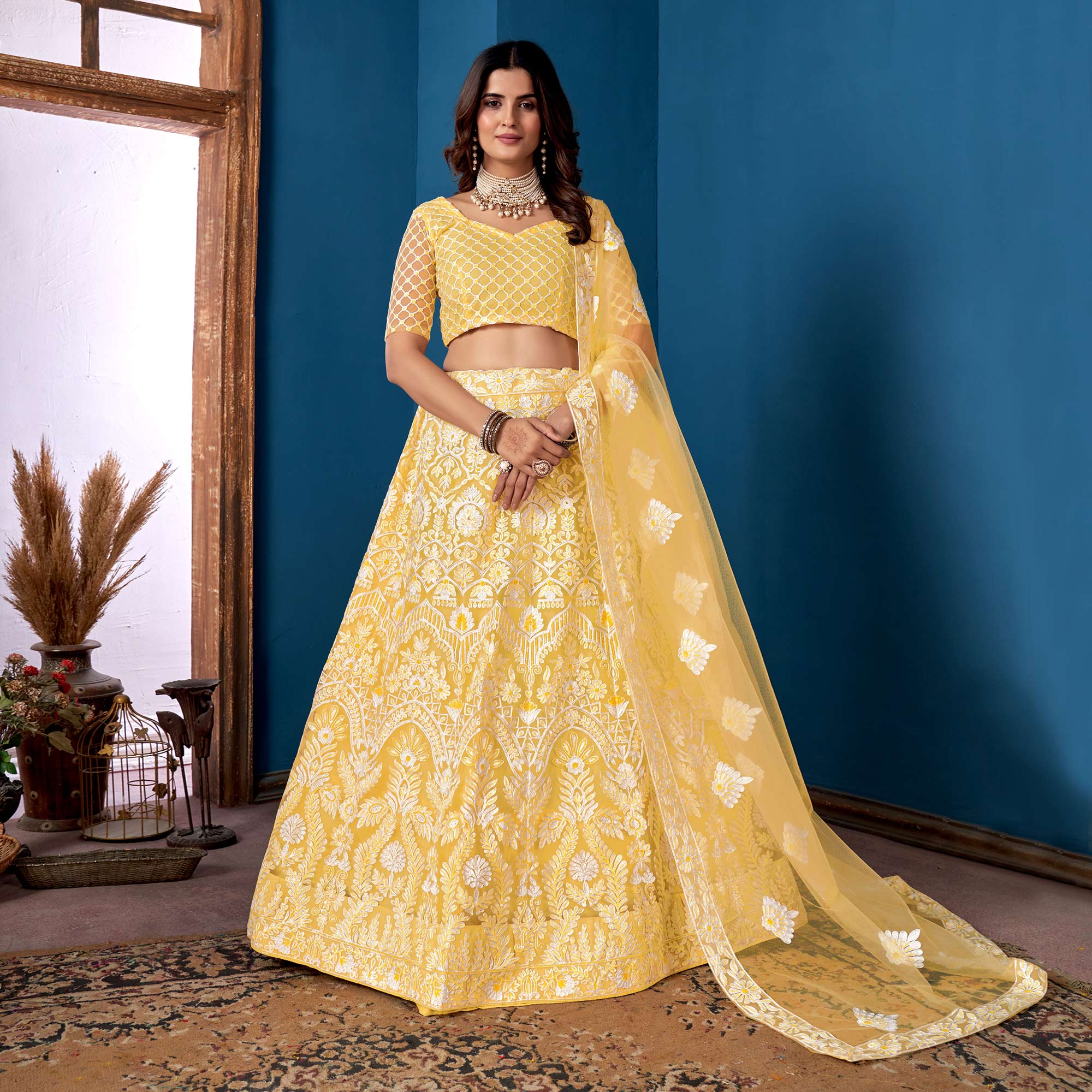 Yellow Floral Sequins Embroidered Net Lehenga Choli