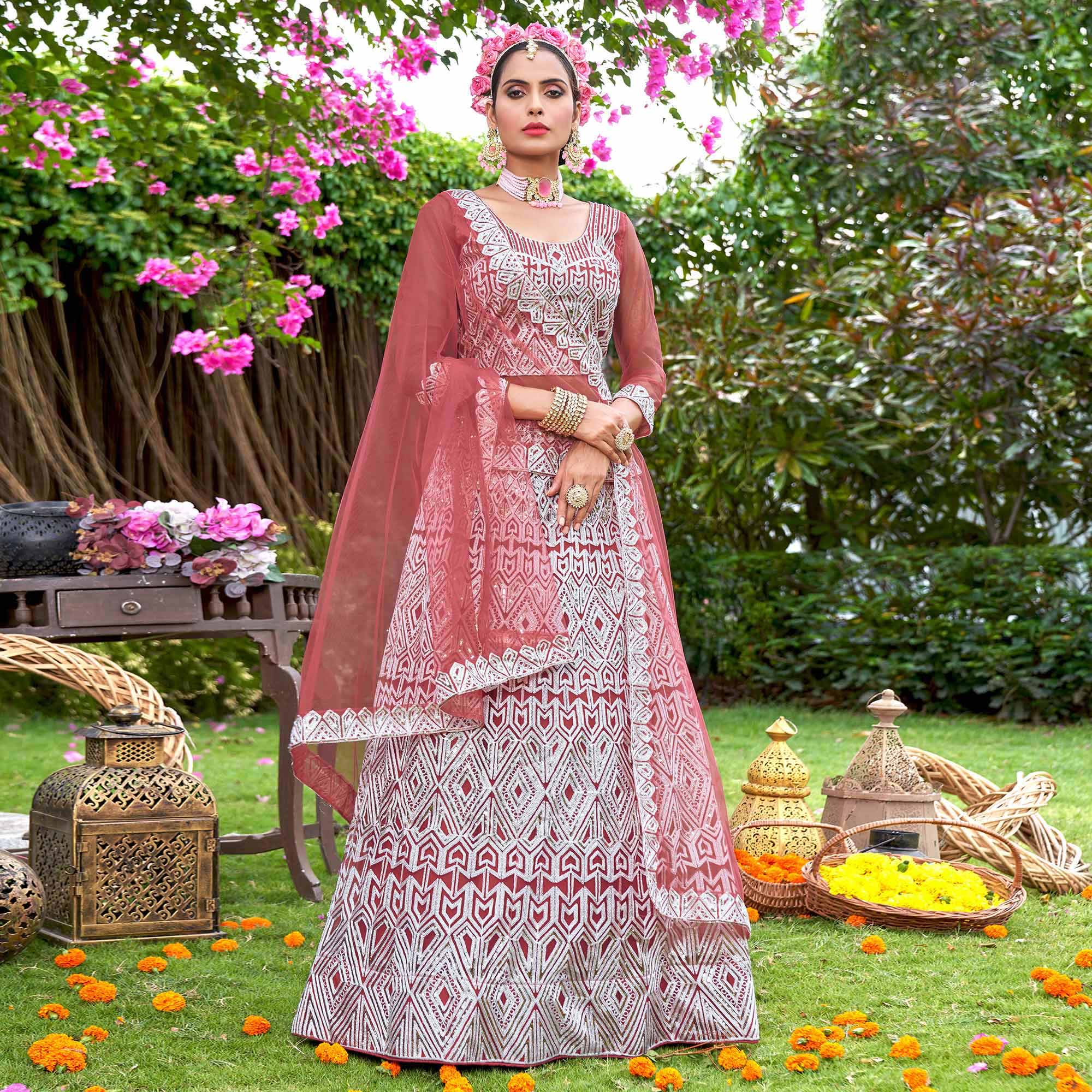 Rust Sequins Embroidered Net Semi Stitched Lehenga Choli