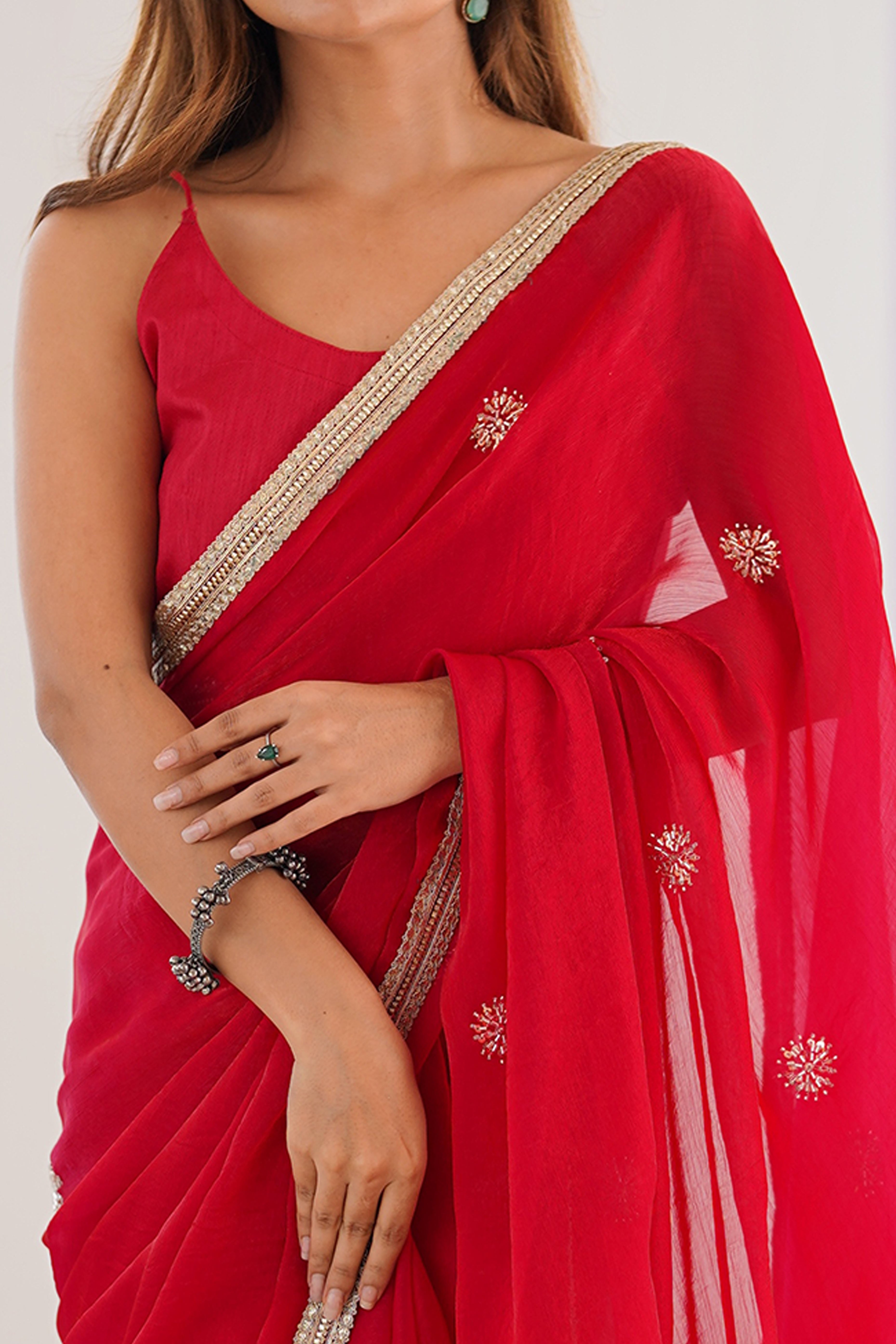 Elegant Red Organza Saree with Delicate Floral Embellishments and Lace Border