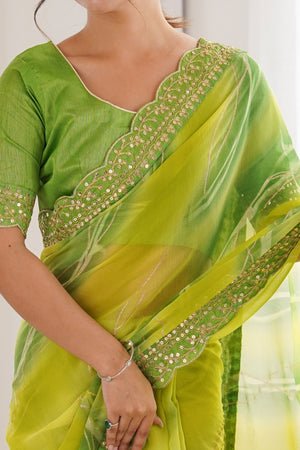 Graceful Green Foil Print Georgette Saree Featuring A Luxurious Cording Sequins Embroidered Border