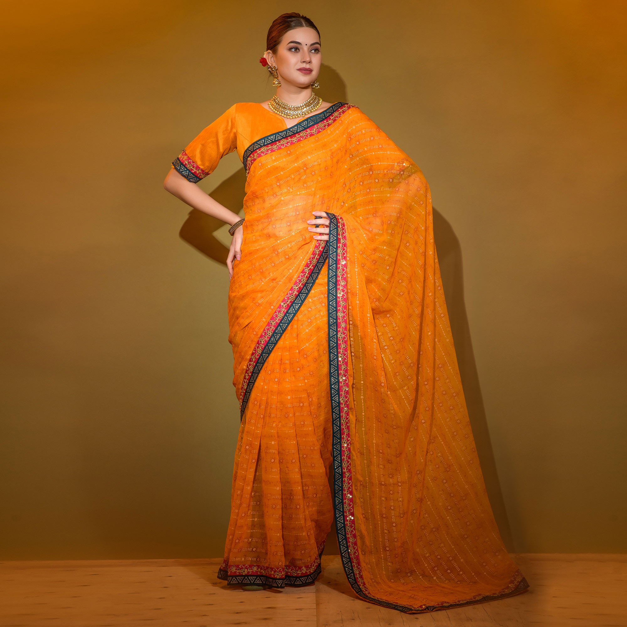 Orange Foil Printed Georgette Saree With Embroidered Border