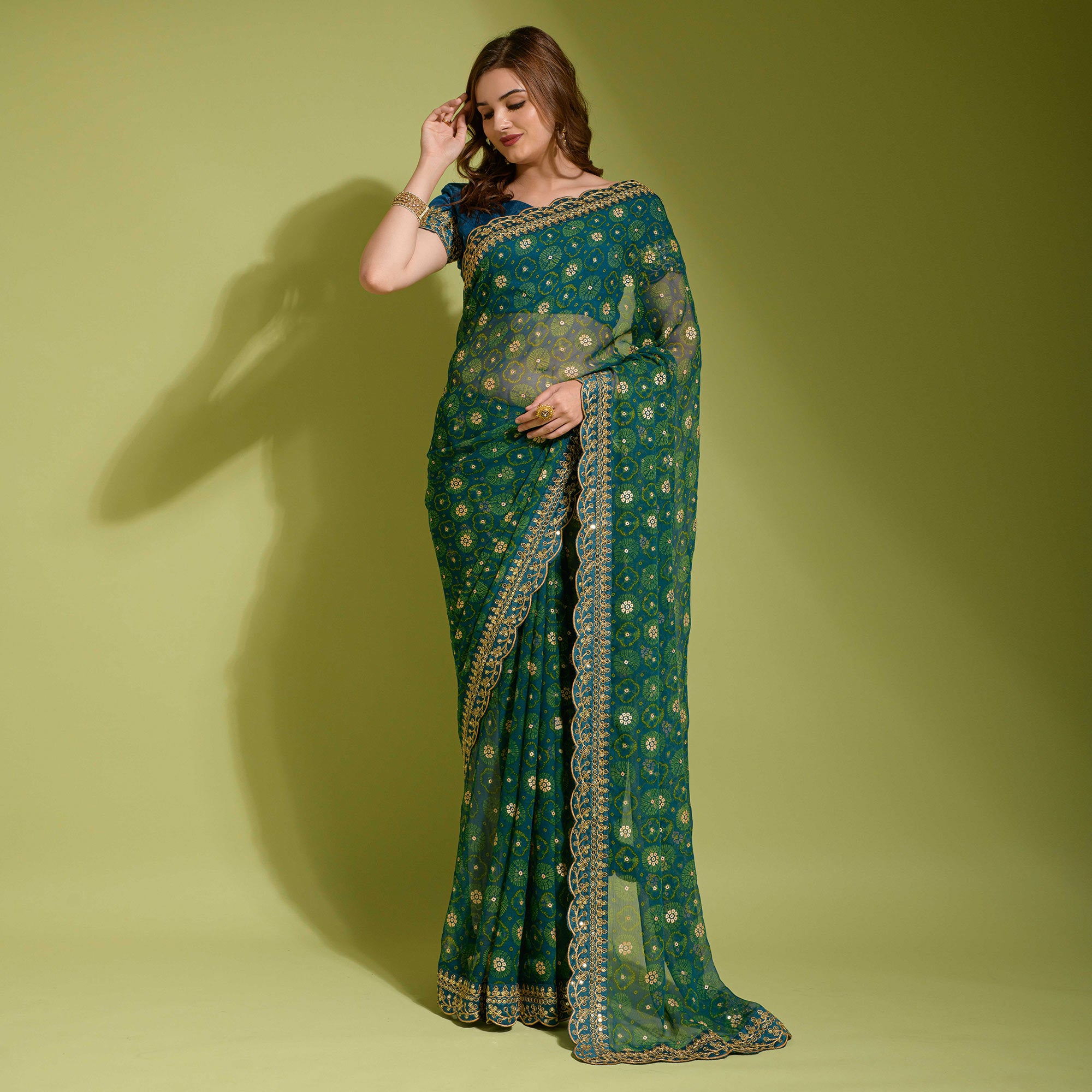 Teal Bandhani Foil Printed Georgette Saree With Embroidered Border