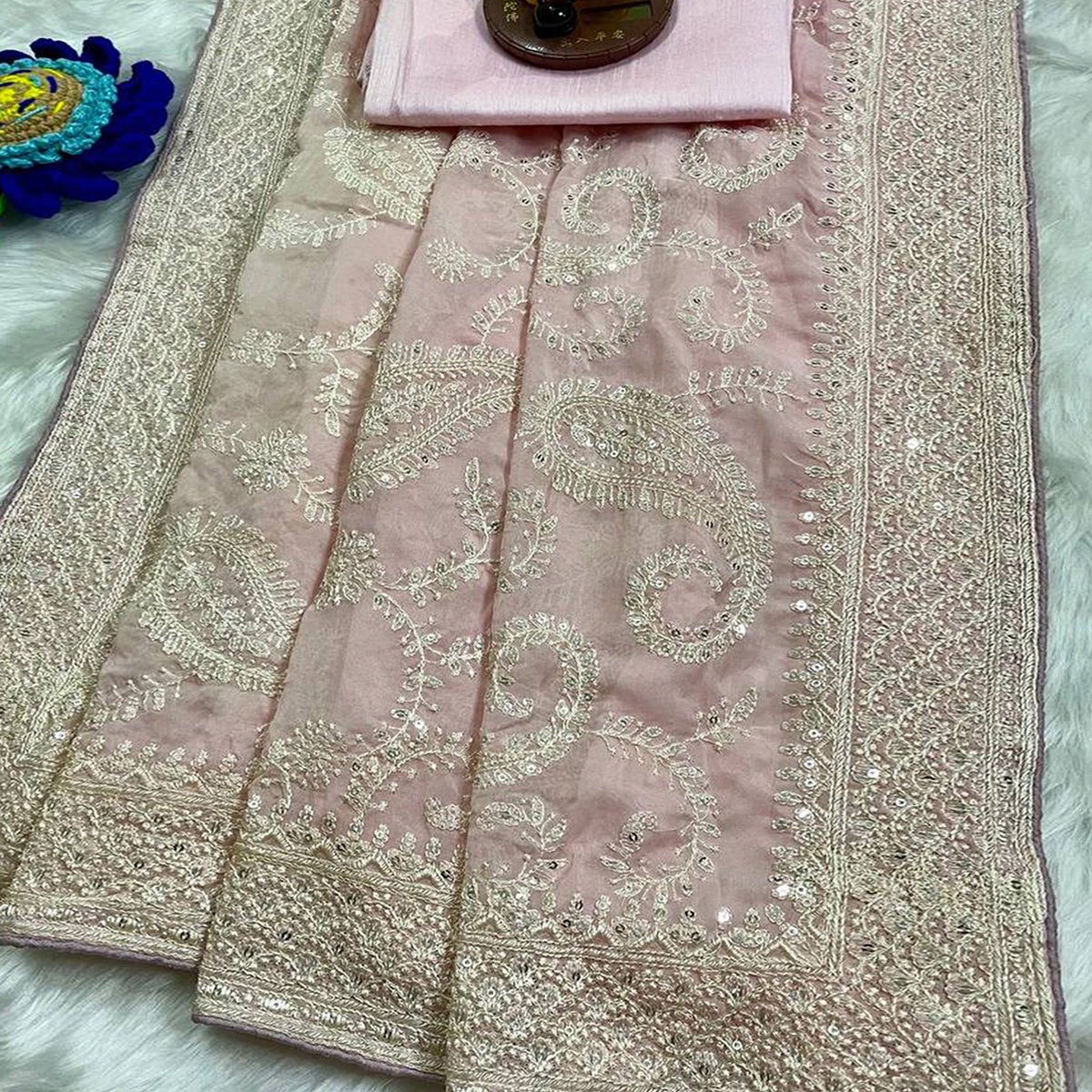 Lustrous Pink Organza Silk Saree Beautified With Paisley Embroidery & Glittering Sequins Work