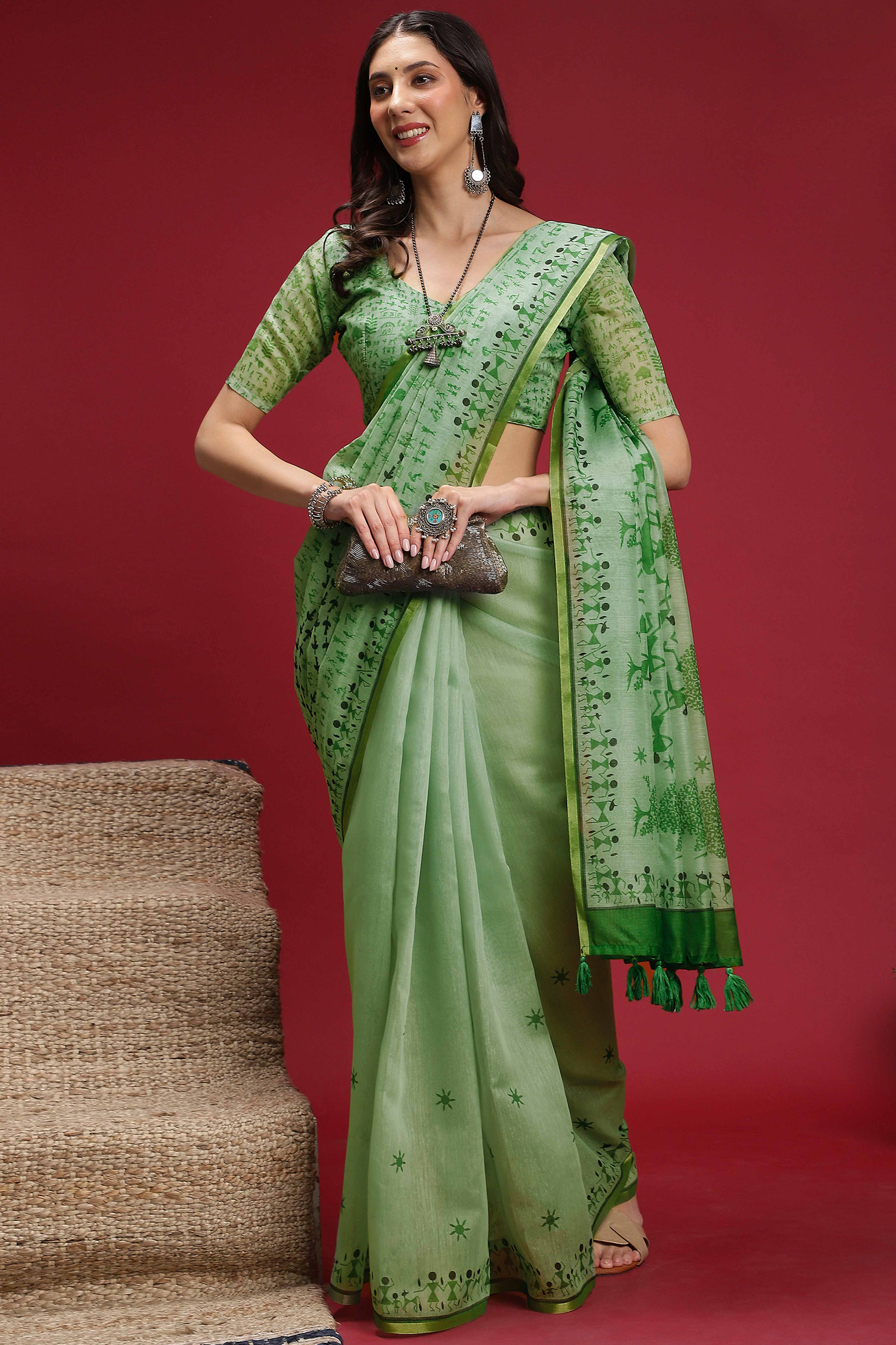 Green Linen Cotton Saree Featuring Traditional Warli Prints & Tassel Pallu