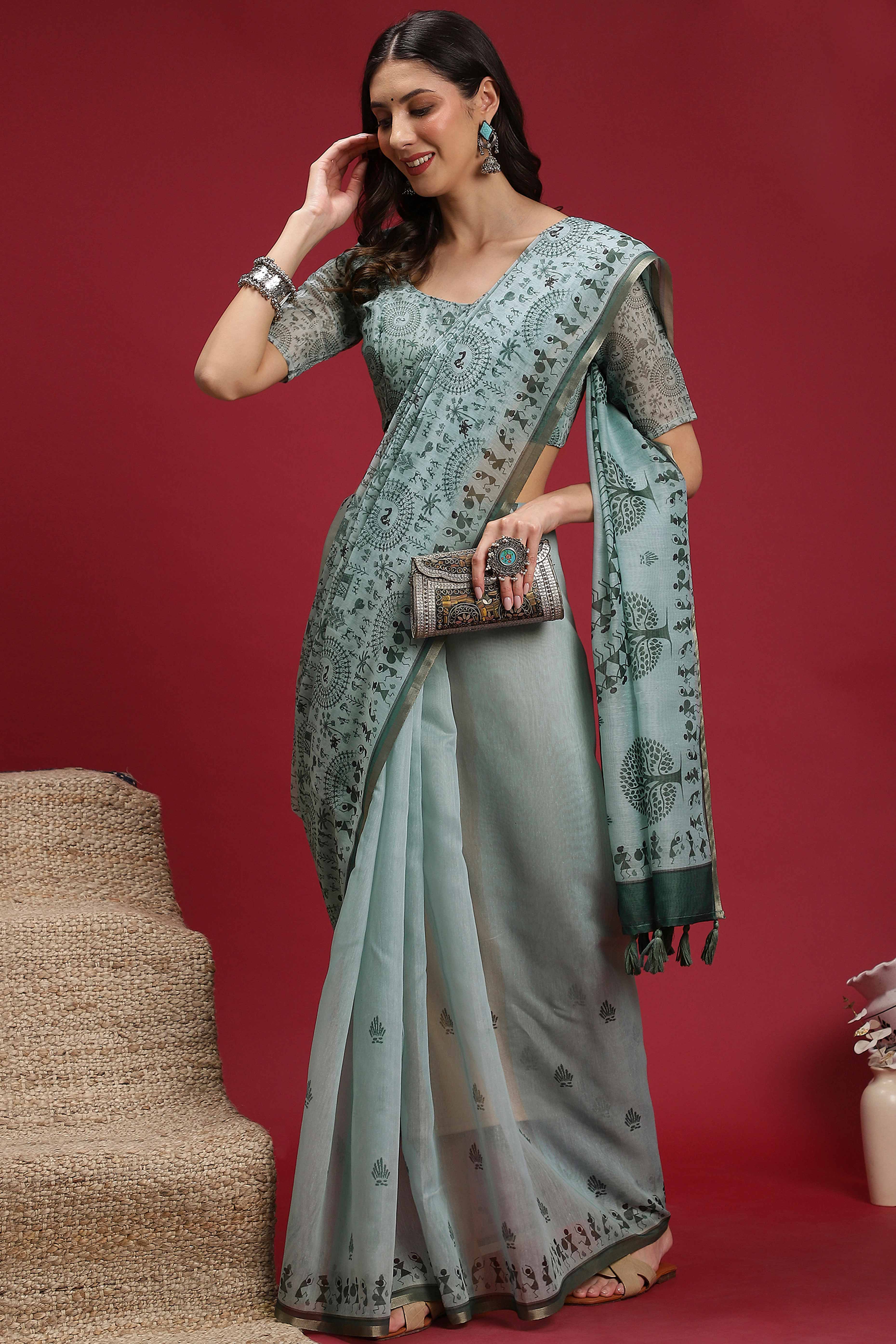 Pastel Blue Linen Cotton Saree Featuring Traditional Warli Prints & Tassel Pallu