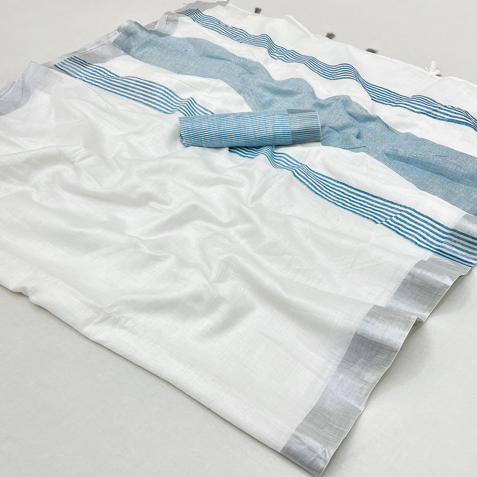 White & Blue Zari Woven Linen Saree With Tassels