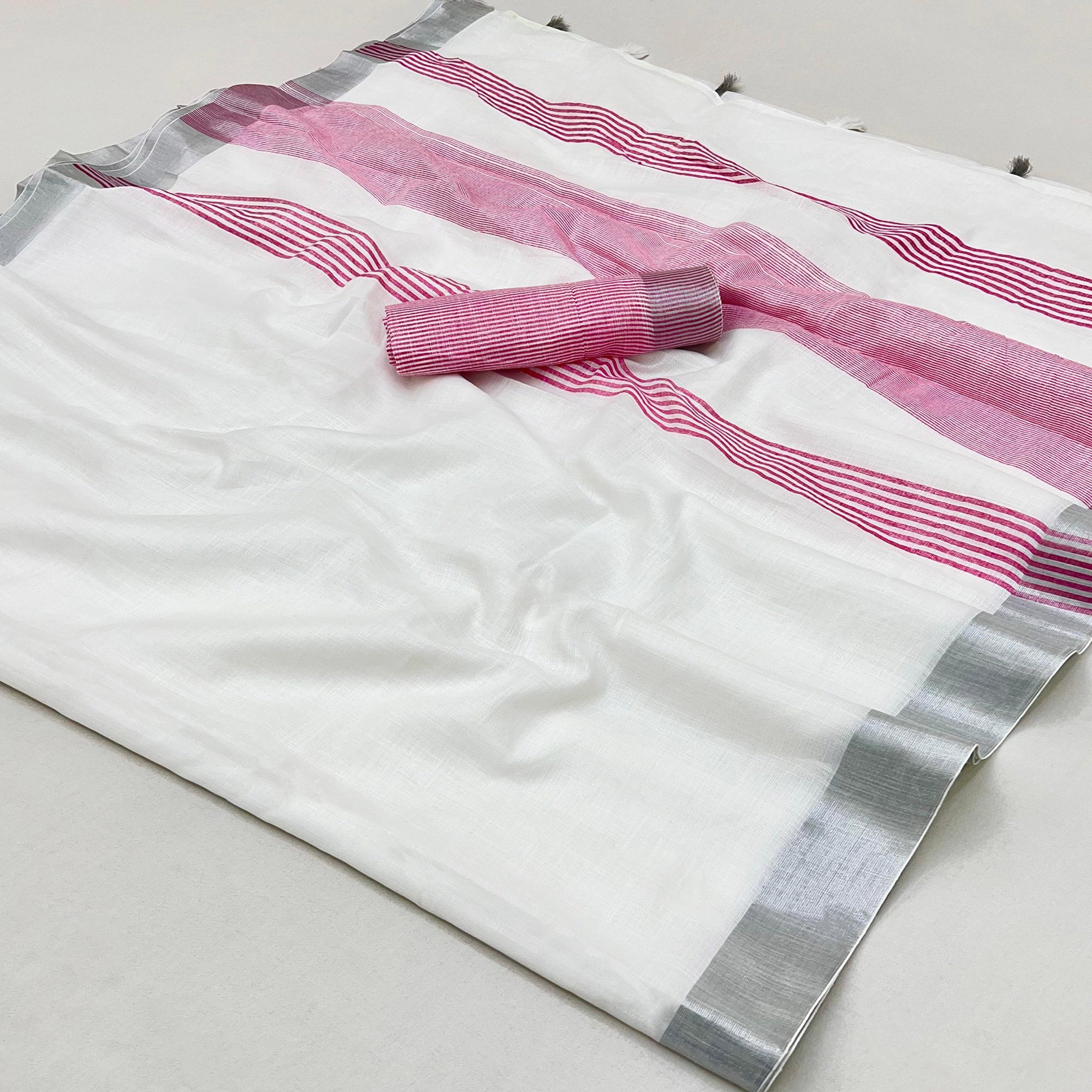 White & Pink Zari Woven Linen Saree With Tassels