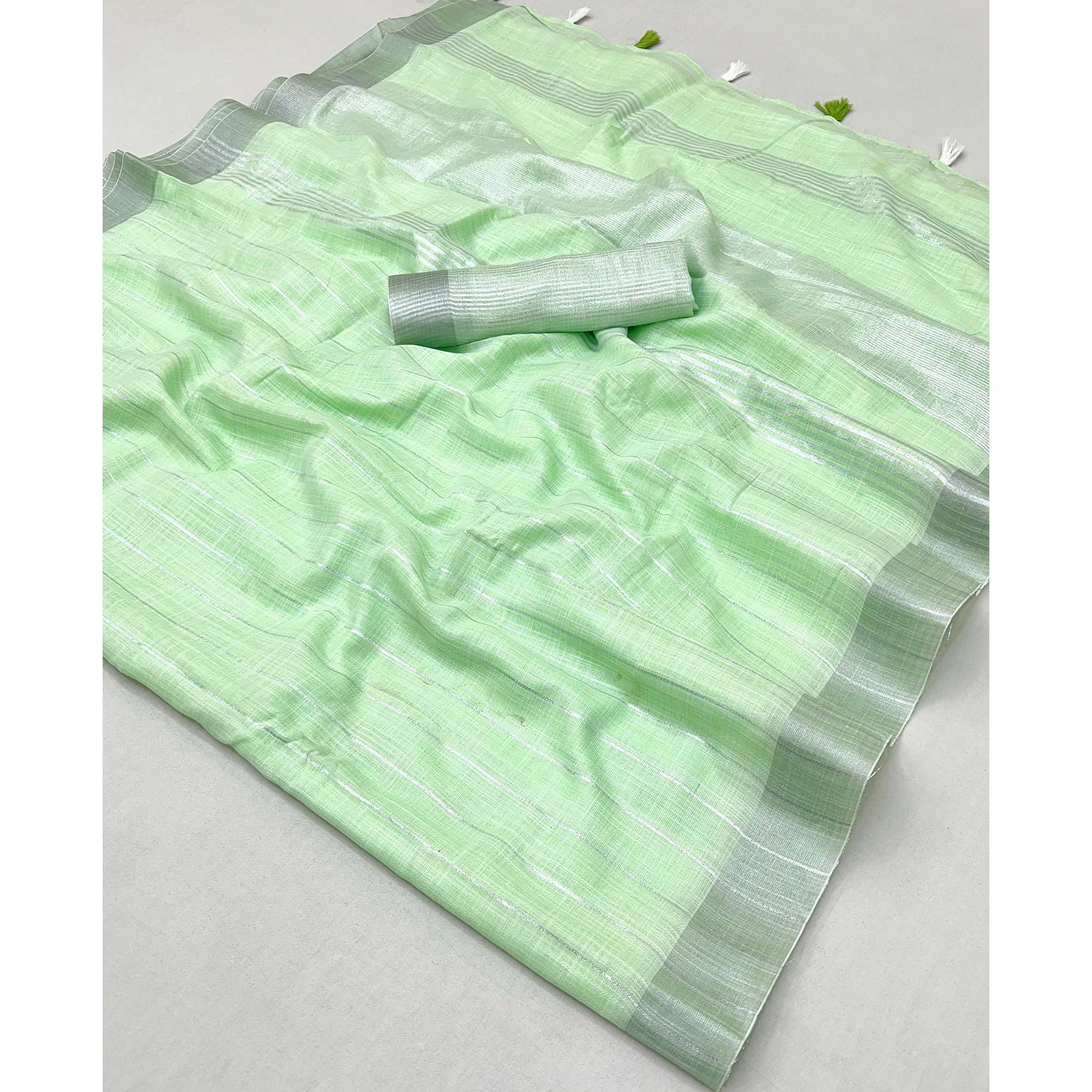 Green Zari Woven Linen Saree With Tassels