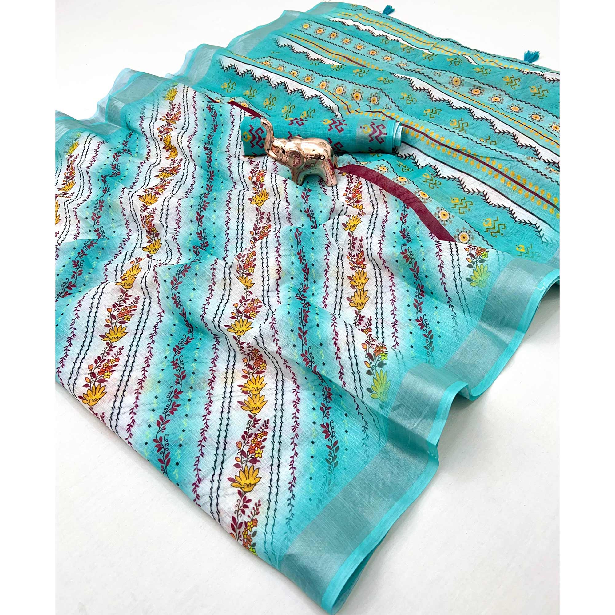 Turquoise Soft Linen Saree with Artistic Print Detailing