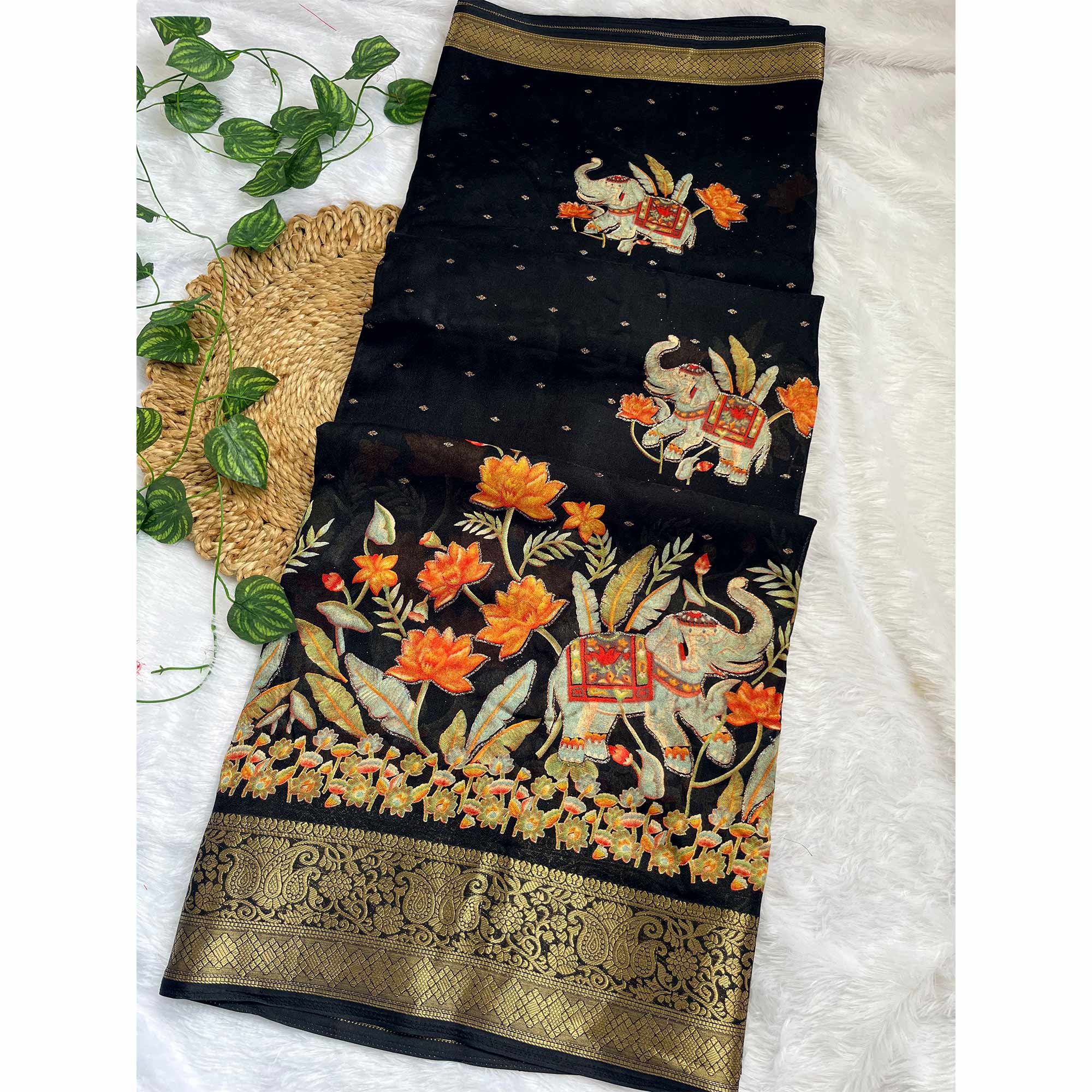 Elegant Black Elephant & Floral Printed Georgette Saree Accented With Gleaming Weaving Zari Border